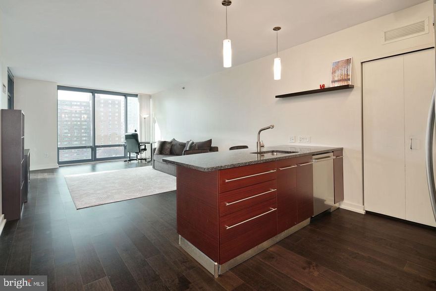 Welcome to Unit 805 at the Murano — a beautifully appointed one-bedroom, one-bath residence offering 822 square feet of sophisticated city living in one of Center City’s most desirable full-service buildings.

This thoughtfully designed floor plan features floor-to-ceiling windows that flood the space with natural light while showcasing vibrant city views. The open-concept living and dining area provides the perfect layout for both everyday living and entertaining.

The modern kitchen is equipped with sleek cabinetry, granite countertops, and stainless steel appliances, seamlessly connecting to the main living space. The spacious primary bedroom offers excellent closet space and easy access to the well-appointed full bathroom.

Additional highlights include hardwood flooring, in-unit laundry, and generous storage throughout.

Residents of the Murano enjoy luxury amenities including 24-hour concierge service, a state-of-the-art fitness center, indoor heated lap pool, sun deck, and resident lounge. Located just steps from Rittenhouse Square, 30th Street Station, top dining, shopping, and major commuting routes, Unit 805 offers convenience, lifestyle, and value in one exceptional package.

An ideal opportunity for an owner-occupant or investor seeking a turnkey residence in a premier Center City building.