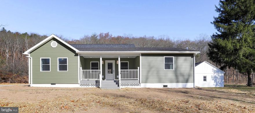 Wow! This one is breathtaking, impressive, and exquisite; seriously there’s no bluffing here, it's dreamy! This newly remodeled 3 bedroom, 2 bath showstopper sits on 1.36 unrestricted acres, offering the perfect blend of modern upgrades and peaceful rural living. Inside you’ll find a gorgeous custom kitchen and bathrooms, a standout primary suite with two walk-in closets, recessed LED lighting, a private laundry room, and even Bluetooth enabled bathroom fans so you can start the mornings with your favorite tunes. Thoughtful updates include new electrical, HVAC, roof, and a brand new septic system. Not to mention a basement for storage or future customization. Outside, enjoy the serenity of the countryside from the beautiful front porch or the spacious back deck that's perfect for entertaining, grilling, or even adding a hot tub for the ultimate relaxation. That's not it, there’s also a detached shed ideal for storage or a workshop. This head-turner is tucked off a private driveway on a flat piece of land just off a state maintained road for easy access all year round. There’s no “cons list” with this one, it truly has it all! Don’t miss it!