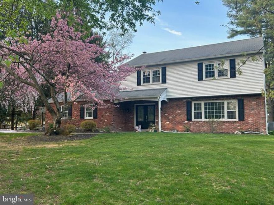 Welcome to 47 Sandy Knoll Drive! This well-maintained 4-bedroom 2.5 bath home sits on a picturesque flat one-acre lot, perfect for soccer games, baseball catches and plenty of room for a pool. Enter the home and notice the hardwood floors throughout. To your right is the front room, which can be used as a living room, home office or den. Continue straight and a large powder room combination first floor laundry is on the right. Then enter the spacious and updated kitchen, featuring granite counter tops, white cabinets, glass tile backsplash and stainless-steel appliances. The eat-in kitchen is open to the cozy family room, featuring a wood burning fireplace. Glass sliding doors lead to the fully enclosed 4 season sunroom porch, which has access to the backyard, perfect for entertaining. Upstairs you will find the primary bedroom at the end of the hall, featuring a nicely appointed updated bathroom, a walk-in closet, and a secondary closet.  Three additional good-sized bedrooms and an updated hall bathroom complete the second floor. You will find the basement partially finished, clean and dry and offering ample storage. Located in a quiet neighborhood, just minutes from schools, shopping and all Doylestown and the Borough has to offer. Come see this home!