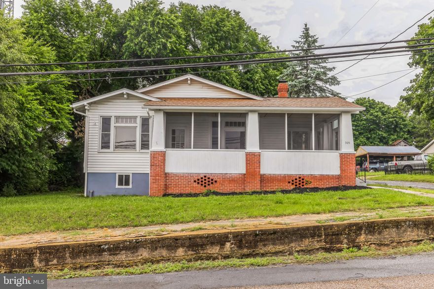This charming house in the Town of Shenandoah offers a blend of classic and modern features, perfect for anyone seeking comfort and convenience. As you approach, you will be amazed by its large enclosed wrap-around porch, providing ample space for relaxation. The property includes a 1-car detached garage, adding to its appeal. Located within easy walking distance of Historic Main St. and near Highway 340, this home boasts a kitchen equipped with Shaker-style, self-closing cabinets, granite countertops, an undermount stainless steel sink, and stylish tile floors and backsplash. The kitchen also includes stainless steel appliances such as a refrigerator, microwave, stove, and dishwasher. The bathroom is designed in a complementary fashion, featuring a granite-topped vanity, tile flooring, a new toilet, tub, and updated lighting. The living room includes a cozy fireplace, perfect for chilly evenings. This beautifully updated home has 3 bedrooms and 1 bathroom, combining modern amenities with a charming location, making it a must-see for potential buyers.