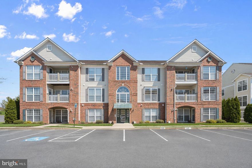 Welcome to the Ridgeview community in Frederick! This second-level unit offers a bright, open floor plan with plush carpeting throughout and abundant storage options. The inviting living area is accented by crown molding and custom blinds. It provides seamless access to the dining space, private balcony, or a flexible area ideal for a home office.  The dining area flows effortlessly into the kitchen, where modern luxury vinyl flooring and natural light enhance the space. The kitchen is well-appointed with a breakfast bar, ample cabinetry, a pantry, and stainless steel appliances, perfect for both everyday living and entertaining.  Retreat to the spacious primary suite featuring plush carpeting, dual closets including a walk-in, and a private en-suite bath with a double vanity and walk-in shower. A second bedroom and full hall bath complete the sleeping quarters.  Residents enjoy community amenities, including a pool and playground, as well as convenient access to major commuter routes such as I-70 and I-270, providing easy travel to Washington, D.C., and downtown Baltimore.