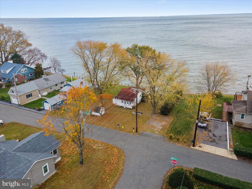 Opportunity and potential on the Chesapeake Bay. The right buyer will see it. The right strategy gets them there.This true waterfront cottage delivers stunning panoramic views and sits in a desirable community with access to a private boat ramp and neighborhood beach for a small annual fee. The home features 2 bedrooms, 1 bath, an open layout, and updates that include a newer roof (within the last 5 years), newer windows, some updated lighting, bamboo flooring, electric heat, and modern appliances. The septic was pumped within the past six months, and the home has public water. If you’re looking for minimal living as-is or a project with major upside, this property offers both. The current owner has already spoken with the county; you may be able to extend the existing footprint approximately 10–12 feet and add a second story (buyers should verify directly with the county). A pier permit or an L-shaped pier option of about 50 feet is also possible. Whether you want a simple waterfront retreat or the chance to build out a larger Bayfront home, this is a rare opportunity to make something special on the water.

NOTICE: Use caution when approaching the stairs leading toward the bulkhead/water. Some boards are damaged. Walk at your own risk.
