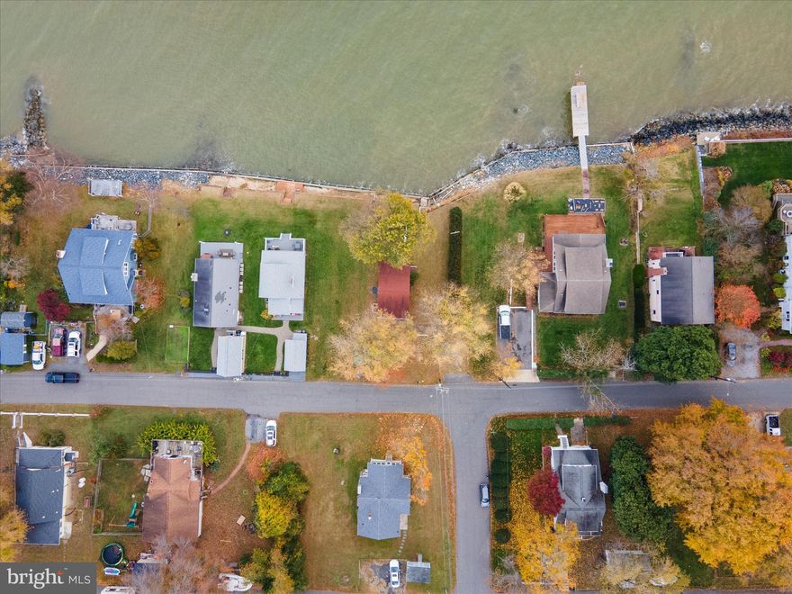 OPPORTUNITY - Waterfront  on the Chesapeake Bay. The right buyer will see it. The right strategy gets them there.This true waterfront cottage delivers stunning panoramic views and sits in a desirable community with access to a private boat ramp and neighborhood beach for a small annual fee. The home features 2 bedrooms, 1 bath, an open layout, and updates that include a newer roof (within the last 5 years), newer windows, some updated lighting, bamboo flooring, electric heat, and modern appliances. The septic was pumped within the past six months, and the home has public water. If you’re looking for minimal living as-is or a project with major upside, this property offers both. The current owner has already spoken with the county; you may be able to extend the existing footprint approximately 10–12 feet and add a second story (buyers should verify directly with the county). A pier permit or an L-shaped pier option of about 50 feet is also possible. Whether you want a simple waterfront retreat or the chance to build out a larger Bayfront home, this is a rare opportunity to make something special on the water.

NOTICE: Use caution when approaching the stairs leading toward the bulkhead/water. Some boards are damaged. Walk at your own risk.