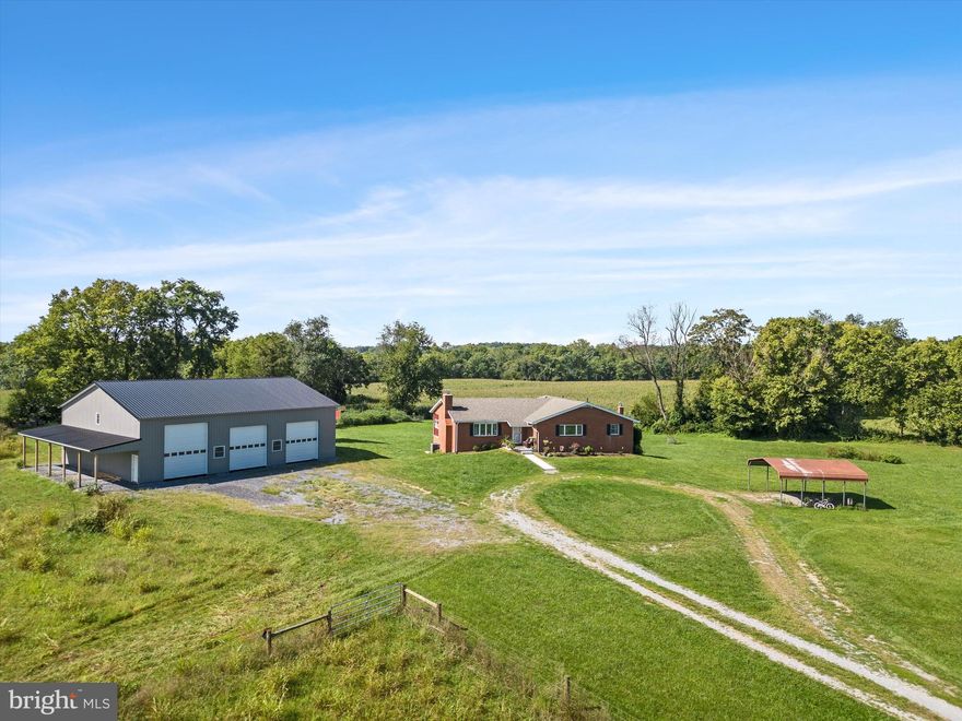 Expansive 14-acre farmette with amazing views and high-speed internet! If you’ve been dreaming of having farm animals and enough space to grow your own food in a superb location, you’ve found it! With a 2-bay chicken coop, 2 sheds, 2 fenced paddock/gardening areas, established fruit trees, and ample room for pastures, this unrestricted property is ideally suited for the active homesteader. Experience the perfect combo of country living and modern conveniences, including a brand new 3,000 square foot pole barn to meet all of your agricultural needs. In addition, the all-brick ranch style home offers 4 bedrooms, each with their own ensuite bath. The mostly finished lower level affords plenty of extra living and storage space, plus the convenience of an attached rear-entry garage with another attached storage area.  The family room features a wood-burning fireplace (new liner in 2021) adjacent to the eat-in kitchen with walk-in pantry. Enjoy the beautiful surroundings from the private back porch in between your daily tasks. Plus, the newer HVAC system and 400-amp electrical panel upgrade provide comfort and peace of mind for years to come. This Harpers Ferry gem is brimming with potential to make your pastoral dreams come true while living within close proximity to the MD and VA borders!