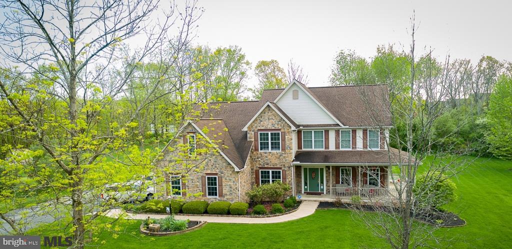 Priced to sell! PRISTINE, MOVE IN READY, OPEN CONCEPT home, with all NEUTRAL COLORS on a LARGE lot- 1.38 PRIVATE acres of tranquility on a CUL-DE-SAC street close to PSU and Geisinger. This SPACIOUS home has a 3-CAR GARAGE, wrap around porch, and a 1,200 SF CUSTOM patio, ideal for relaxing. The interior features a 2-STORY foyer, gleaming HDWD staircase & floors on 1st floor, French doors, formal LR/DR, OFFICE. Family room with 2 story ceiling, skylights, gas fireplace and a SECOND STAIRCASE TO THE UPSTAIRS. The bright & airy eat-in kitchen is open to the family room, beautifully suited for entertaining. Convenient laundry room/ mudroom and 1/2 bath complete the 1st fl. Second floor Master Suite w/2 VERY LARGE WALK IN CLOSETS, a Master Bath w/dual vanities and sitting area, glass walk-in shower & jetted tub. Large basement provides ample storage, is plumbed for a future bathroom and can readily be customized to suit your needs.