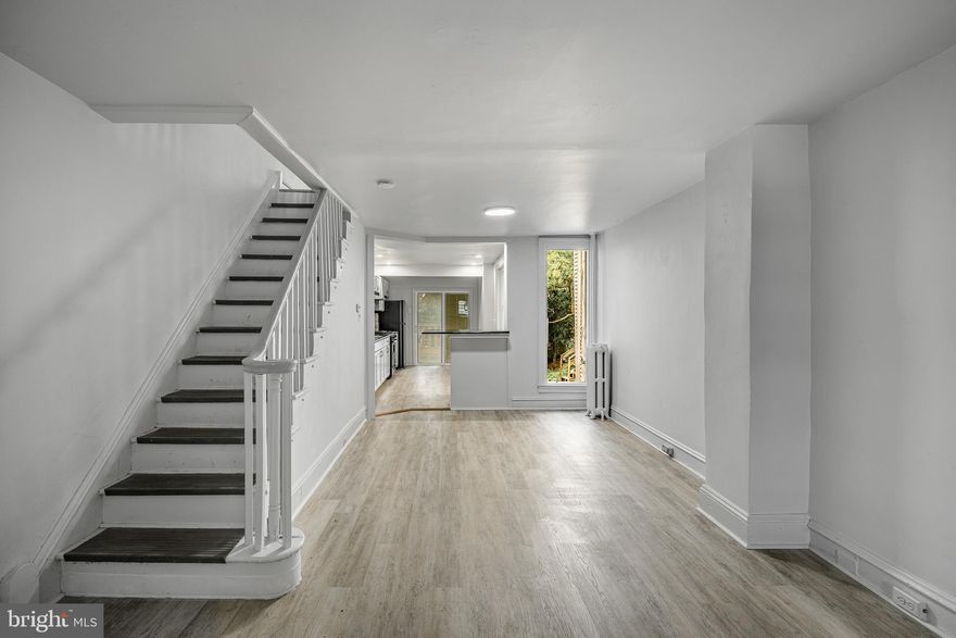 This fully renovated 3 bedroom, 2 full bathroom home features an open concept layout with a spacious living room and large kitchen, perfect for entertaining. The main level also includes a convenient first-floor laundry with brand new washer and dryer. Enjoy the huge rear deck for cookouts and gatherings, along with a private backyard. Upstairs offers three generous bedrooms and a full bath, while the basement provides additional potential with a second full bathroom already in place. Conveniently located near 69th Street Station and all major public transportation, this move-in-ready home combines modern updates with an unbeatable location.