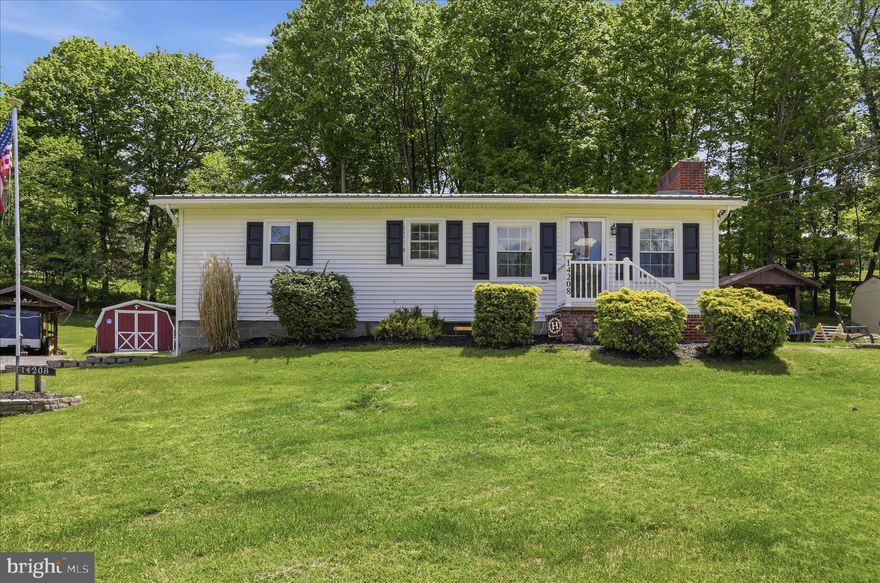Beautifully maintained ranch style home in Ellerslie, MD offering a blend of character, comfort, and recent updates. The main level features hardwood floors, a cozy fireplace, and updated kitchen with oak cabinetry and butcher block counters. The recently updated finished basement provides additional living and entertainment space, while the screened-in porch offers a peaceful setting to relax and enjoy the outdoors. This home includes 2 spacious bedrooms, 2 full bathrooms, and situated on a 2.15 acres. This property has beautiful creek frontage, and woods in the rear of lot. Additional features include mini-split air conditioning, three heat sources, a one-car garage, and ample parking with a convenient half-circle driveway.