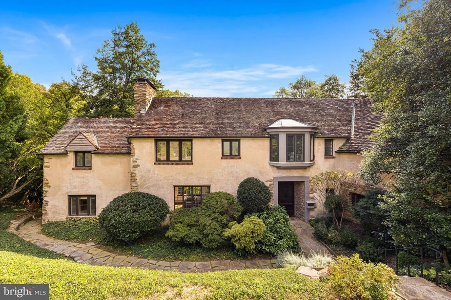 Exquisite jewel of Chain Bridge Road on OVER HALF ACRE LOT backing to Battery Kemble Park offering UNRIVALED LIGHT, PRIVACY, and BREATHTAKING PARKLAND VIEWS! Romantic French Manor style facade reveals an expansive and airy interior, ethereally beautiful backyard and surrounding gardens, and dramatic parkland views from multiple porches and oversized leaded glass windows. Main level features generously-proportioned living and dining rooms, study, and large kit w/ breakfast/family area. 3BR each with en suite upstairs including primary suite with large dressing room/bath. Sizable, finished lower level with large family room, Bedroom suite with private entrance. Easy parking in 2-car garage w/ additional driveway space. Dont miss this once-in-a-lifetime neighborhood treasure!