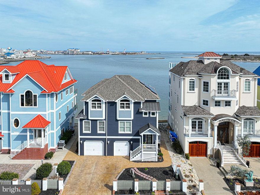 First time offered on the market, this beautiful custom built waterfront coastal style home.  Enjoy views of the Bay, Ocean and Assateague Island from the waterside of the house.  Located in highly sought after West Ocean City, within walking distance to the marinas, restaurants, beach, and the Fishing Center.  This home features 4 beds (2 primary suites (1st and 2nd floor), 4 1/2 baths, hardwood floors, granite countertops, gourmet kitchen, full balconies on both levels waterside, rip rapped shoreline, 1 deeded boat slip with lift, access to dock, 2 car garage, ground level bathroom, and workshop.  Embrace the best Ocean City has to offer by owning this amazing home.  Call today for your own private tour.  All showings will need to be approved by seller,  and will require proof of funds or ability to purchase from buyer prior to showings.