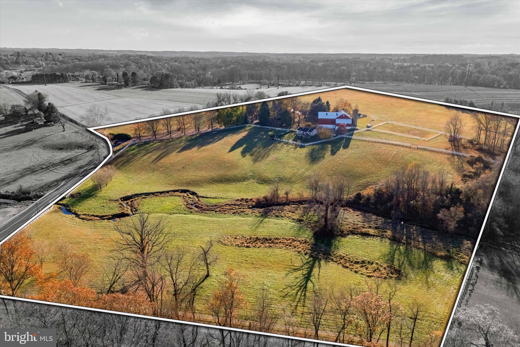 Nestled amidst over 57 acres of rolling countryside, Twin Chimneys is a rare gem—a premier equestrian and multi-use estate blending historical charm with modern luxury. This exceptional property boasts a circa-1762 Federal-style manor house, guest house, 2-story bank barn, expansive grounds, and an array of amenities that elevate rural living to a refined art form.
At the heart of the estate stands the stately main residence, offering six bedrooms and three and a half baths. This property was originally a two story stone farmhouse, built in 1790. In the 1800’s the three story brick post federal house was built. The bricks for this project were kilned on the property, near a large sycamore tree beside the White Clay Creek that wanders through the property. The twin brick chimneys were a functional necessity when built, and still adorn the home today.
Step inside modern day Twin Chimney, to the grand center hall, where timeless elegance greets you. The large open foyer is flanked by a formal dining room equipped with a built-in butlers pantry and a sizable living room with a detailed, wood-burning fireplace. The living room lends access through double doors to a cozy sitting room. Tucked lovingly away is the parlor with a timeless, staple wood burning fireplace and the original keeping room, a historic centerpiece, featuring an oversized hearth that once served as the home’s culinary hub, now a captivating nod to the past.
The main level seamlessly combines old-world charm with thoughtful modern upgrades. The open-concept kitchen, renovated in 2008, is a chef’s dream with custom butternut cabinetry, an AGA oven, a Sub-Zero refrigerator, a built-in steamer, and an espresso machine, and now features a breakfast nook addition. The airy family room features a stunning cathedral ceiling, skylights, a floor-to-ceiling stone fireplace, and opens through French doors to a spectacular outdoor oasis.
The pool area is paved in Pennsylvania bluestone and features a hot tub and a gazebo, perfect for entertaining or serene relaxation. A nearby fire pit and second gazebo overlook the scenic vistas, offering an ideal setting for sunset gatherings.
The second floor of the home boasts a luxurious primary bedroom wing. This includes a private sitting area, fireplace, access to a wet bar and intimate balcony with sweeping views. Additional bedrooms, including a converted office and laundry space, ensure ample flexibility for family and guests. The third floor features a custom dressing room and two additional bedrooms, while a walk-up attic on the fourth level provides generous storage.
Just steps from the main house, a remarkable 5,000+ square-foot bank barn invites endless possibilities. With six oversized stalls and equipped with water and electricity, the barn is ideal for equestrian pursuits. Its loft, overlooking the picturesque landscape, is perfect for hosting grand events or celebrations.
Outbuildings include a charming three-bedroom guest house that offers comfortable accommodations for visitors or staff, while the surrounding grounds include many fenced pastures, run-in shed, a springhouse, gardens, and soft rolling landscape overlooking its own portion of White Clay Creek.
Conveniently located near shopping and amenities and offering easy access to Route 1, I-95, and major hubs like Wilmington, Philadelphia, and Baltimore, Twin Chimneys is as accessible as it is enchanting.
This extraordinary estate is more than a home—it’s a legacy waiting to be passed down. Additional acreage is available for those seeking even greater opportunity. Schedule your private tour today to experience Twin Chimneys’ unmatched beauty and versatility.