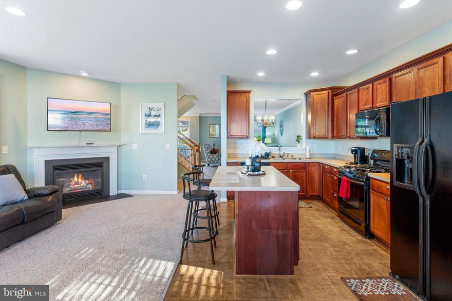 Welcome to 200 Regatta Lane — a beautiful, well maintained brick end-unit townhome in the highly sought-after Port Aquia community, offering over 2,700 sq. ft. of bright and open living space. The main level features a spacious kitchen with a center island that flows seamlessly into the cozy family room, complete with a gas fireplace and access to a deck overlooking the fenced backyard — perfect for entertaining or relaxing outdoors. Upstairs, you’ll find two generous primary suites, each with a private bath and walk-in closet. The finished walkout basement adds even more versatility with a large rec room, full bath, laundry area, and a bonus room ideal for your home office, guest space, or gym. Additional perks include under-deck storage and two assigned parking spaces.

You’ll love the prime Stafford location, offering effortless connectivity for daily commuting and weekend outings. With multiple nearby I-95 interchanges, traveling north to Northern Virginia/DC or south to Fredericksburg is quick and convenient. US Route 1 (Richmond Highway) is also close by, providing a reliable alternate north–south route.

This home is exceptionally located for those commuting to major military installations:
Marine Corps Base Quantico (MCB Quantico): Often less than a 15–20 minute drive to the south gate.
The Pentagon, Fort Belvoir, and Joint Base Anacostia-Bolling (JBAB): All easily accessible via I-95.

Move-in ready and close to shopping, dining, and commuter options, this home offers the perfect blend of comfort, convenience, and style. Schedule your tour today!