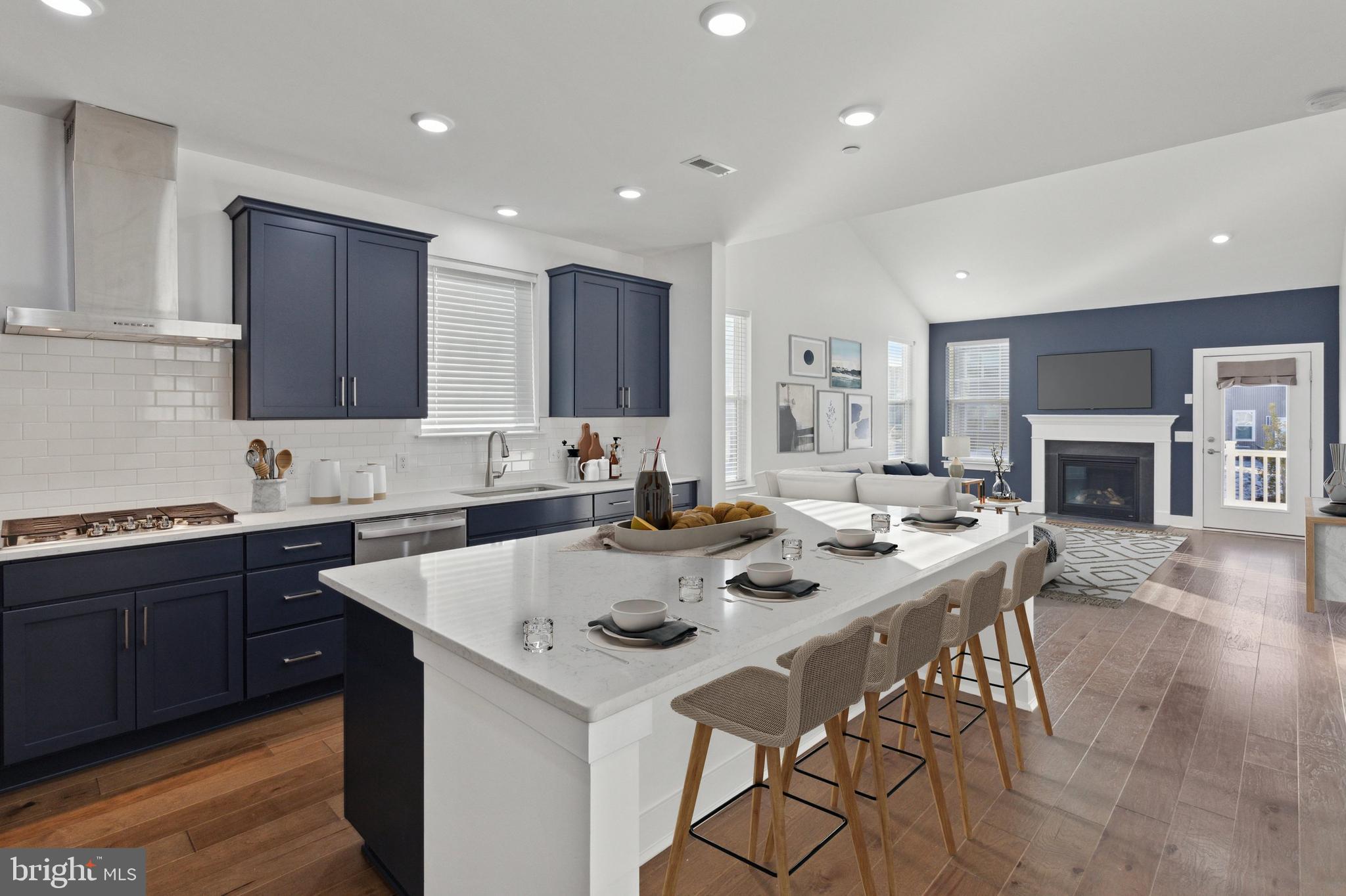 This luxurious 2 year young end unit carriage home with an abundance of upgrades is located on a quiet lot in the neighborhood of Exton Grove. This Asher Model has been modified to feature Primary Suites both on the main and second level, it also features a custom finished lower level.
A covered front porch welcomes you, stepping inside, you're greeted by a spacious foyer, powder room and hardwood floors that flow throughout the entire first floor. Through the foyer you will find an open-concept living space which includes a large Great room which gives the owner flexibility to utilize/furnish as you like, and an impressive gourmet kitchen. The great room with a cozy gas fireplace, creates a warm and inviting atmosphere and excellent flow for entertaining. The modern navy and white, light and bright oversized kitchen features an abundance of cabinetry and counter space and is highlighted by quartz counters, 42 in cabinets, tile backsplash, a large seated island, and stainless steel appliances including a gas 5 burner cooktop and wall oven/microwave combo.
The first Primary Suite is located on the main floor and features a large bedroom space, dual closets and a spa-like en-suite bathroom. The Primary Bath features a double vanity, a fully tiled stall shower, frameless glass shower door and a private WC making it not only luxurious but also extremely functional. The laundry Room is conveniently located adjacent to the Primary Suite.
Upstairs and additional Primary Suite is equally as luxurious with dual closets and a stunning bathroom with double vanity, a fully tiled stall shower and a private WC. Two additional good sized bedrooms each with a walk-in closet space, a full hall bath with double vanity, tiled shower and a linen closet complete the upper level.
The custom finished daylight lower level offers a large recreation/family room with luxury vinyl flooring. A full bath with marble tile, neutral finishes, a tiled stall shower with marble insert and a bedroom/office just add to the functionality of this space.
Living in Exton Grove means enjoying maintenance-free living at its finest, with an HOA that takes care of lawn care, landscaping and snow removal. Located in the highly acclaimed West Chester School District - and connected to the Chester Valley Trail, great for recreation and wellness! The location is unbeatable, with easy access to the PA Turnpike, Route 202, Route 476, and Route 76, making commutes to Philadelphia, Wilmington, and New York a breeze. Local shops, restaurants, and schools are just minutes away, and the shops of both Exton, West Chester and Malvern and SEPTA Regional Rail to Center City are also within a short drive.