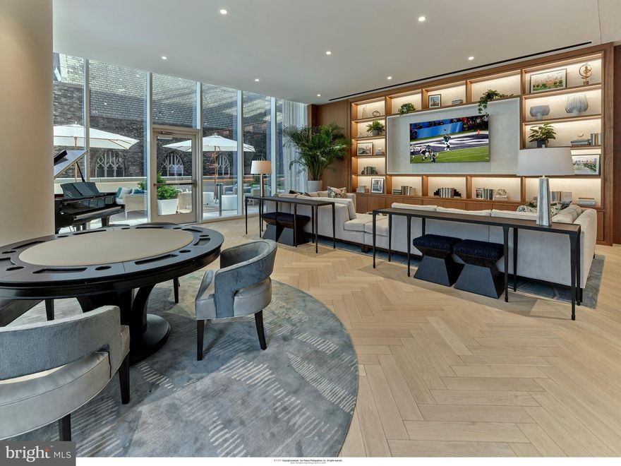 Arthaus, a commanding new residential high-rise in Philadelphia’s performing arts district, presents Unit 2101:  A stunning 3-bed, 2.5-bath, 2,030 SF single-level residence with City Hall and skyline views priced at $2,025,000.  

This maintenance-free, move-in ready, home offers high-end interior design, resort amenities and white gloves services.  Tax abatement is available.  Whether you’re a busy professional, retiree or globe trotter, 2101 is a MUST SEE!

Arthaus impresses from the moment you enter.  The tall solid wood door with elegant hardware sets the stage, leading to a spacious, light-filled foyer with two large closets and convenient powder room and laundry facilities.  The great room offers panoramic views of the city featuring a blended kitchen, living and dining space with soaring ceilings, floor to ceiling windows, wide-plank Havwood flooring and a weather-protected walk out balcony. Drenched in natural light this space is bright, airy, and feels twice its size on paper.

The chef’s kitchen is everything you need for hosting, with a large center island that seats four.  The upper and lower cabinets are polar white matte by Poggenpohl and the countertops Golden Gate quartz with matching backsplash. The high-end, stainless appliance package includes: Wolf, Bosch, Sub-Zero and Asko appliances and door fronts have been fully integrated into the cabinet design for a seamless look.

The primary suite and two guest bedrooms are on the north side of the condominium.   Hardwood flooring from the great room continues into the first bedroom; perfect for an optional home office. The second bedroom is a quiet retreat for visiting guests with gorgeous skyline view and walk-in closet. The full bath in the hallway is shared by the two secondary bedrooms and is finished with porcelain Calacatta tile floors, super white quartz countertops, and polar white matte Poggenpohl cabinets. The spacious Owner’s suite is wrapped in 10' floor-to-ceiling windows and features an oversized walk-in closet. A Badeloft soak-in tub, double vanity with Robern mirrors and super white quartz marble, Contempo white marble floors and shower tile, and a Kohler toilet closet complete the best-in-class bathroom package. 

Arthaus is a modern masterpiece crafted by renowned developer Carl Dranoff, designed by Kohn Pedersen Fox and built by Intech Construction.  Its architecture and amenities prioritize wellness and well-being, from the stunning Monet-inspired mosaic in the lobby to the private resort on the 6th and 7th floors, featuring a pool, fitness facilities, spa, salon, pet park, outdoor terraces, lawns, gardens and more.  White glove services include 24-doorman, concierge, chauffeured town car and car valet. 

This home comes with 1 parking license. With the 10-year tax abatement annual real estate taxes are approximately $3,560.