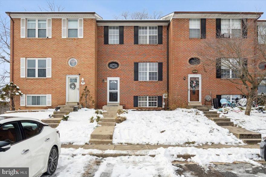 Welcome to this brick-front townhome in Players Village tucked away in an incredibly convenient and compelling downtown location! This home is very  well priced for a three bedroom in downtown and move in ready. The homeowner has recently improved the home dramatically for the next owner. As you enter, you are greeted by a light filled entryway and a bright and open space. The hardwoods on the main-level have just been refinished and the entire home freshly painted. The main level features a spacious, eat-in kitchen, with stainless appliances and double wall oven with ample cabinetry.  Main level also features a powder room and ease of access to rear deck. The upper level offers a primary suite with en-suite bath, two additional bedrooms and a shared full bathroom.  The bathrooms have been improved with new LVP flooring, new light fixtures and are showing well. The lower level is fully finished with luxury vinyl flooring and a full bathroom. There is a rec room/family room in the basement with a potential guest space or home office as well. Enjoy ease of access to the backyard through sliding glass doors. The fully fenced yard offers privacy. Enjoy an evening on the new back deck that can be accessed through the kitchen with stairs to the rear yard. NO HOA fees. TWO assigned parking spots(1189). Close proximity to all Downtown Frederick has to offer like the YMCA, East St development, and Staley Park. New hot water heater in 2022, refrigerator and microwave. New roof in 2014 and HVAC in 2016. Welcome home!