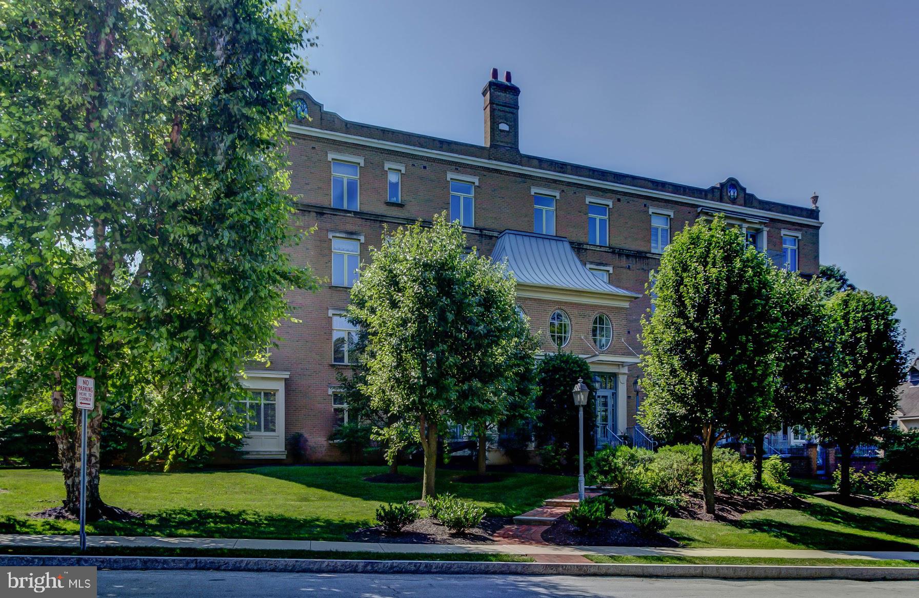 Looking for convenience, privacy and a sunny space all rolled into one fabulous European style condo? Come take a look at "Austin Park Place"! You won't find a condo on the Main Line that compares. With only 11 units, this 4 storied boutique condominium building has much to offer including a "walk to Bryn Mawr" location, underground heated parking (complete with locked storage units), and a great view of Austin Park. This 2nd floor unit, recently featured in Main LIne Today magazine, was designer remodeled in 2017, and outfitted with stainless steel Jenn-Air kitchen appliances, white carrara marble countertops, designer grade tile, natural fiber carpets in each bedroom, and 2 gorgeous completely renovated full bathrooms. This unit features new designer lighting, generous storage and closet space, 9-foot ceilings, solid arched doors, crown molding, and beautiful brand new wide-plank white oak flooring. It boasts a generously sized dining room, and a large living room complete with a (nonworking) antique marble fireplace and french doors that lead to a private balcony directly overlooking the park's mature trees. The master bedroom has a king size walk-in closet and ensuite fully remodeled bath with his and her vanities. There is a laundry room with full size washer and dryer. No pets allowed in the building. Condo fee includes water and sewer, common area maintenance, exterior maintenance, snow removal, trash removal and all electric except for plug-ins. Average PECO bill last 12 months is $59.22! Walkable to retail, Bryn Mawr theatre, Rosemont train station and more. Garage parking for one vehicle and additional outside parking for second car and/or guests. Caretaker lives in carriage house on-site. Must see!
