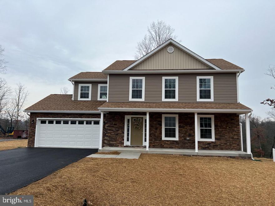 Great family home situated well established family friendly neighborhood. Great commuter location and convenient to schools & shopping. Kitchen has granite countertops, kitchen island, stainless appliances and is open to family room. LVP flooring on the main level in the great room, kitchen foyer and powder room. Living room features a gas fireplace with mantel and carpet.  10 X 12 deck with vinyl rail accessible from the kitchen for easy grilling or enjoying your morning coffee.   This home features 3 large bedrooms plus a primary suite with tray ceilings on the upper level.  All bedrooms are standard with ceiling fans. Primary bath has ceramic flooring and over sized shower with seat and glass doors, walk in closet.  Laundry room on bedroom level with ceramic tiled flooring.  Walk out basement with rough in plumbing for future 3rd bath. Two car garage, insulated, drywalled, opener and insulated garage doors.   WV transfer taxes are paid by Purchaser.