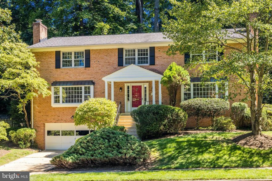 Open Sunday 10/9 from 2-4pm and Accepting Back-up Offers!  Approx 4,200 SF with amazing options for any type of living scenario.  Sunny 3-level brick colonial in Chain Bridge Forest with 5 bedrooms & 4.5  bathrooms.  Hardwood floors (on main and entire upper level), new carpeting in lower level and an oversized (613 SF) 2-car garage.  Main level features huge living room with wood burning fireplace,  dining room, eat-in kitchen, sunny family room with beamed ceiling & wood burning fireplace, a private den/office and laundry room.  Upper Level features hardwood flooring, 5 bedrooms and 3 full bathrooms.  Lower Level features spacious recreation room with fireplace,  new carpeting,  private au pair/in-law  suite and extra storage.  Home is 65% in Arlington and 35% in McLean and has two Tax ID's (Arlington: 03-003-077 = 8,694 SF) & (Fairfax: 0314 22 0023 = 4,543).    Home is well kept/good condition but due to estate status will be sold "AS-IS".  TXT LSTR with questions.