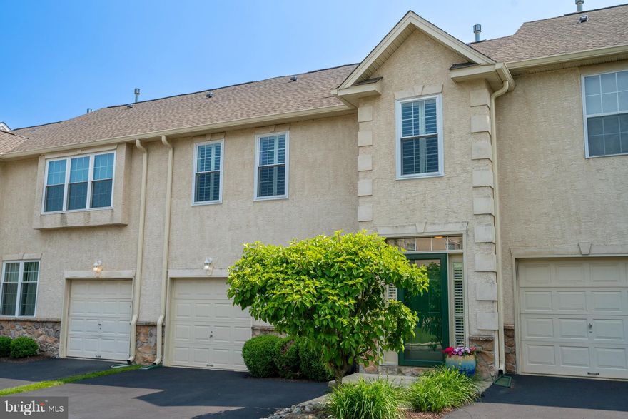 Beautifully updated townhome in sought after Hampton Green of Montgomeryville. This spacious three bedroom home owns a  long list of high-end upgrades and thoughtful features, with room for a fourth bedroom as part of the finished basement! Interior highlights include an open floor plan with a fresh coat of soft, neutral paint over almost every room.  Windows have been updated to ensure energy efficiency. Four inch remote control louver blinds cover the family room windows, while all other windows are covered with the same high-quality blinds. Two year new HVAC system includes a new humidifier and energy efficient filter. Newer premium plank flooring throughout the first floor while the carpeted upstairs and basement floors are in perfect condition.  New ceiling fans were installed for year-round climate control. Custom closets were installed in the bedrooms. The brand new front door keeps your exterior looking its finest.  The association has just installed a new roof and gutters. This home is crystal clean and ready for you!  Impressive two-story family room has tall windows covered by motorized blinds bringing comfort, style and privacy. The gas fireplace adds a cozy ambience. Completely renovated kitchen features all the cabinetry you need with a granite topped island and counters, stylish new hardware and pendant lighting. The brand-new dishwasher is yours. A roomy pantry and newer sliders that open to your wooden deck. Bedrooms are roomy with closets expertly designed by Closet Works for optimal storage and organization.  The master bedroom spoils you with a large soaking tub, stall shower and double vanity. Bathrooms tile was professionally regrouted. Two more bedrooms, a hall bath and  laundry room complete the upstairs. The finished basement completes your living space with a separate room, serving as an office, fourth bedroom or what fits you best.  New egress window with shutters and escape ladder ensures safety and natural light . Association monthly fee covers all exterior maintenance and gym,  landscaping, snow removal, trash, roof and gutter replacement are also included.  Montgomery township residents have their own state of the art Community Center, with courts, a full gym, a track and out door water playground. Reside in the award-winning North Penn School District and enjoy easy access to routes 309, the 202 Bypass, and more. Nearby shopping includes the Shoppes at English Village, Costco, brand new Sprouts Gourmet Market, Wegmans, Trader Joe, Target and Rhoads Garden. Enjoy dining at many area restaurants or choose from one of two great movie theatres!  Beautiful nearby parks  include a new Dog Park. 
Make this exceptional home yours before someone else takes it! All the updates and well maintained home make it the perfect place to settle in and enjoy low-maintenance living.