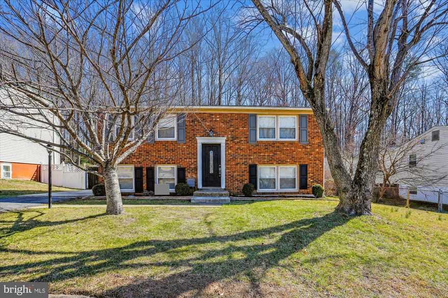 Beautiful split level home located in Dale City.  New carpet and paint all throughout! Step into the welcoming living space showcasing beautiful wood flooring. The gourmet kitchen boasts granite countertops, upgraded stainless steel appliances, and tile flooring, connecting seamlessly to the deck. The main level features a generously sized master bedroom, a second bedroom, and a full bath. On the lower level, you'll find a relaxed recreational room and an additional bedroom, along with a full bathroom. There's also a versatile den/office area and a convenient laundry room, all with direct access to the fenced yard.  Enjoy all the backyard has to offer with a covered patio, shed, firepit, and deck! Driveway and street parking. Just a short drive from I-95, shopping districts, and an array of dining options.