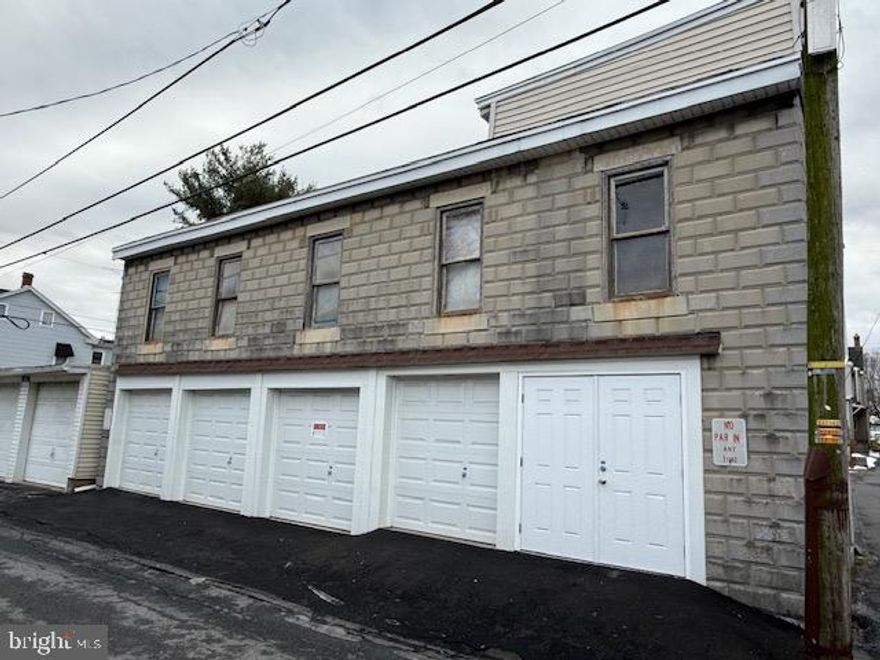 Storage Garages 4 Bays plus parking and upstairs storage

Legend has it that this garage was used to build model T Fords and they built part of the units upstairs and lowered it by the mechanical lift to the first floor street level when you look at this unit, check out the mechanical lift the whole floor raises from the first floor to the second it's interesting  One of a kind.
There is $720 monthly income and the upstairs unit is available may have potential for an apartment upstairs