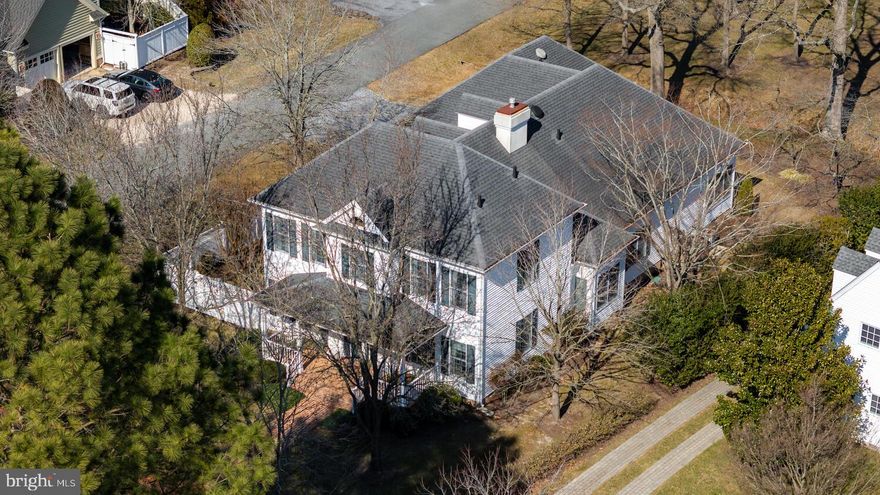 Located in the highly sought after Cooke’s Hope community, this gracious Colonial offers a perfect blend of comfort and style. Positioned on a prominent corner lot, the home boasts spacious formal living and dining rooms, with abundant natural light throughout. The main level features a cozy living room with a fireplace and built-in bookshelves, as well as an open family room and kitchen ideal for both entertaining and everyday living. The main floor is highlighted by a primary suite, two half baths, and a convenient laundry center. Beautiful hardwood floors flow seamlessly throughout the main living areas, and 9-ft ceilings enhance the sense of openness.  Upstairs, you'll find two additional bedrooms and a full bath, while a huge floored attic offers ample storage space or potential for future expansion.  Enjoy outdoor living with a stone paver patio, privacy fencing, and a covered front porch overlooking a scenic park. The oversized two-car garage adds convenience, while high-speed internet and cable are available through Easton Utilities. Community amenities ensure an easy lifestyle with exterior maintenance packages, a tennis facility, dog park, miles of nature trails, fitness center, parks, ponds, and a community pier.   Located off the highly desirable Oxford Road Corridor, this home is just minutes from downtown Easton and the Talbot Country Club. Don't miss this rare opportunity to own a beautiful home in an exceptional community, while enjoying the Eastern Shore Lifestyle!