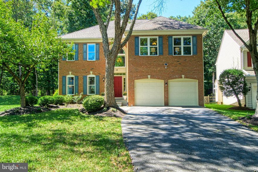 Elegant while comfortable, this updated home has the indoor space and outdoor living areas you desire. A generous brick paver patio overlooking the beautiful landscaping and woods behind the home provide the ideal space to relax and entertain. Inside, the custom built-ins and trimwork, gas fireplace, spa-like primary bathroom, and vaulted ceilings add glamorous touches to everyday life. The additional three ample guest bedrooms have walk-in closets and ceiling fans for comfort. Huge, finished lower level offers space for entertaining, play and guests. Set on a quiet cul de sac, this home is convenient to major commuter routes, shops and restaurants, parks and biking/ hiking trails, and schools. The nearby bus stop goes to two Metro (red line) stations. Built in 1996, the sellers are the original owners and through the years have dilligently updated and maintained the home with a new roof, windows, AC system, water heater, kitchen, bathrooms, flooring, light fixtures, and much more. Low HOA fees due quarterly.