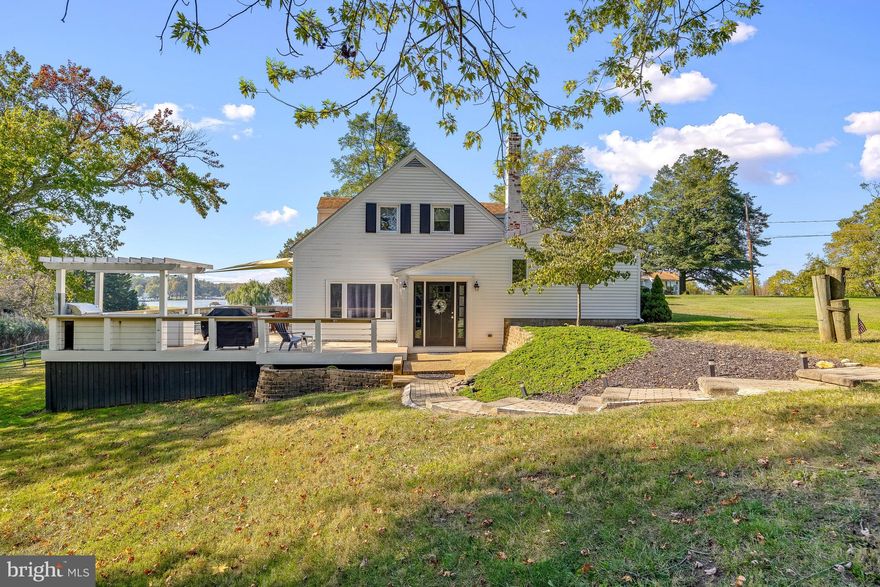 Set along the water’s edge on 1.89 acres, this waterfront retreat offers a rare combination of space, setting, and flexibility. A parcel of this size is exceptionally uncommon for waterfront properties in Edgewater, providing a sense of openness and room to enjoy the shoreline that is rarely found. With a private dock and water views, the setting invites boating, paddleboarding, and relaxed days along the water. A private fenced walkway leads to the dock, complete with a boat lift, jet ski lift, and convenient kayak storage along the shore, with quick access by boat to the Chesapeake Bay and downtown Annapolis.

The outdoor living experience is a true highlight, featuring an expansive deck with a pergola and outdoor kitchen, ideal for entertaining, crab feasts, or unwinding at sunset.

Inside, the 3-bedroom, 2-bath home is thoughtfully designed for comfort and functionality. The main level offers a seamless flow between the living room, dining area, and kitchen, along with a full bedroom and bath, mudroom, laundry, and additional storage. Upstairs, two spacious bedrooms share a full bath, creating a private retreat for family or guests.

Currently operating as a successful VRBO, the property also presents an excellent income opportunity, with its waterfront setting appealing to those seeking a Chesapeake Bay escape.

Located in Edgewater, with easy access to local marinas, waterfront dining, and downtown Annapolis—and within convenient reach of Washington, D.C.—this property is well-suited as a full-time residence, weekend retreat, or investment opportunity.