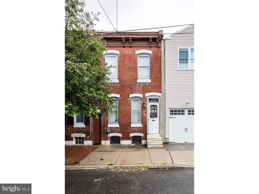 Charming turn of the century, 2 bedroom, 1 bath home with exposed brick, original plank hardwoods, and a large green yard. Location is so desirable and in walking distance to all of the great Fishtown cafes, social, and shopping venues. Enter in to this 2 story brick from with decorative cornice. The living room and dining room are divided by the stair case which is open on one side. The living room has a book nook and exposed brick and the formal dining room has closets as well as a custom peek through wall with built in shelves that can be accessed from the kitchen and dining area.  We love that this wall has exposed brick adding to the rustic feel of the home. The kitchen has a tile floor and modern white flat panel cabinets and modern stainless pulls, an electric range, refrigerator, over mount stainless sink, butcher block counters, and goose neck faucet. Access to the large rear yard from the kitchen. The 2nd floor has a master bedroom with ample closets and bonus storage above. The 2nd bedroom has direct access to the bath and both bedrooms have original plank hardwood floors. The bath is large with octagon tile floor, a pedestal sink, and a soaking tub with shower. Central air, tasteful lighting and fixtures, and original features throughout.