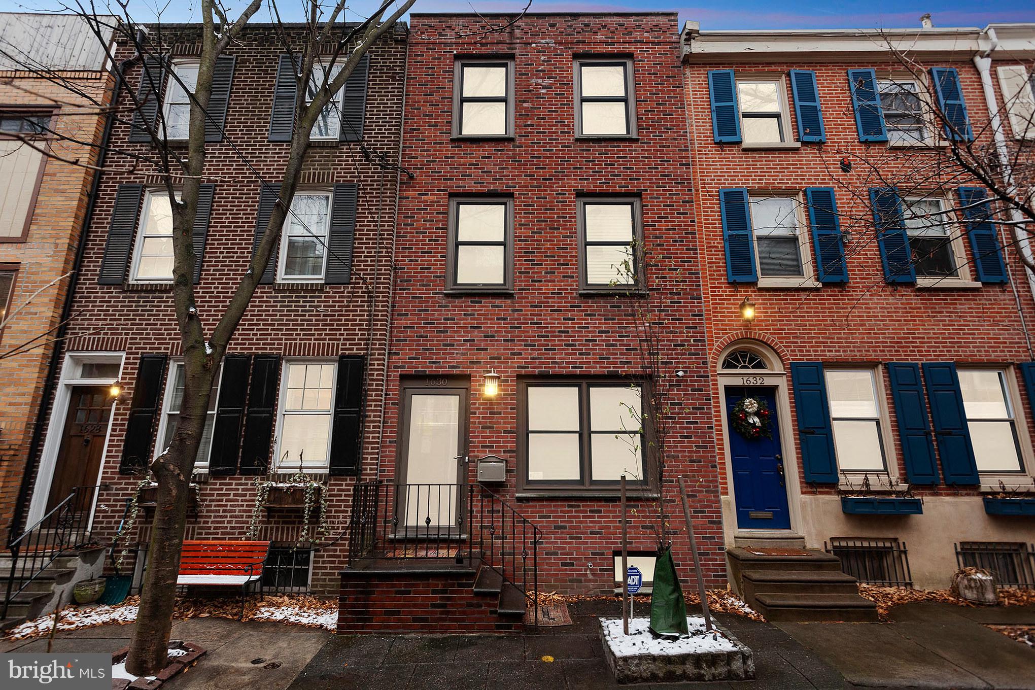1630 Waverly Street. Location, location, location with GARAGE!! The property is in Center City Philadelphia, Rittenhouse square area, but tucked away on a quiet tree-lined street.This magnificent home is truly unique. Featuring a 1.5 car GARAGE with lots of room for storage, an electric garage door opener with access to rear street!! This historical property has been tastefully transformed into an ultra modern home. The property is divided into 2 parsels. The main home features 2 bedrooms, 2.5 bathrooms, office space, a great finished basement, private yard, security system, 6 surveillance cameras monitoring entire front and back of property. Step into the front door of the home, which features a beautiful living room with hardwood floors that leads to a gorgeous kitchen, perfect for entertaining guests, with a large bar top as well as stainless steel appliances, granite counter tops, open staircase, lots of cabinet space and tons of natural light shining through the sliding glass doors that leads to a private courtyard. The 2nd floor has 1 bedroom, 1 full bathroom with a jacuzzi tub and a sitting area which would make a great office space. The 3rd floor is a complete master suite with an open layout and a beautiful wall to wall marble tile bathroom. The basement is fully finished for additional living space, with gorgeous slate tile, a 1/2 bathroom and a separate laundry/storage room. Walk out of the rear sliding glass doors through the courtyard which leads to a 2 story guest quarters. This large bi-level unit features a living room with hard wood floors, a kitchenette, 1 large bedroom with 2 spacious closets and a full bath. This rear unit would make a great In-Law suite or be perfect for overnight guests for privacy. This gem of a home is walking distance to lots of great shopping, fabulous restaurants, theaters, public transportation and much much more. A MUST SEE!