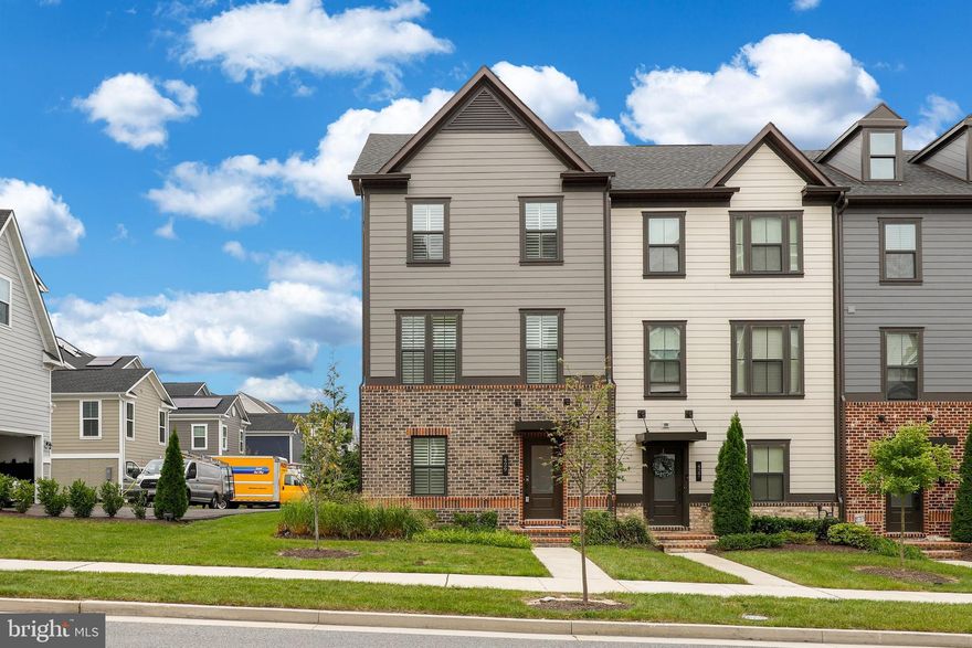 Exceptional in every aspect, this meticulously crafted 2,226 sqft luxury end unit townhome in Greenleigh at Crossroads surpasses expectations. The thoughtfully designed interior seamlessly blends modern sophistication with functionality, creating a move-in ready masterpiece. Upon entering the lower level, you'll find a well-appointed study, a convenient powder room, a home office, and easy access to the 2-car garage. Ascend the stairs to the core level, where an impressive open floor plan awaits. Revel in the details, from the hand-scraped hardwoods to the designer lighting and the luxurious wood and composite louvre shutters. The bright living room and open dining area, featuring an atrium door opening to a spacious low-maintenance deck, provide an inviting space for relaxation and entertainment. The gourmet-ready kitchen steals the spotlight with its 42" espresso Shaker cabinetry, granite counters, stainless steel appliances, and an oversized center island with a breakfast bar. A newly installed powder room adds convenience, complemented by a bathroom on each level. The recently renovated arctic white stone accent wall with an electric fireplace and LED lighting adds a touch of elegance. Upstairs, the generous owner's suite beckons with a tray ceiling, propeller-style ceiling fan, and a walk-in closet. The garden bath boasts a double vanity, an oversized shower with bench seating and craftsman tile work, and a soothing soaking tub. Beyond the home's impeccable features, Greenleigh at Crossroads offers a host of community amenities, including a clubhouse, outdoor pool, fitness center, trails, dog park, shops, and dining. With easy access to I-95 and I-695, as well as proximity to downtown, hospitals, Penn Station, theaters, museums, and more, this residence combines luxury living with unparalleled convenience. Welcome home to a lifestyle that exceeds expectations.