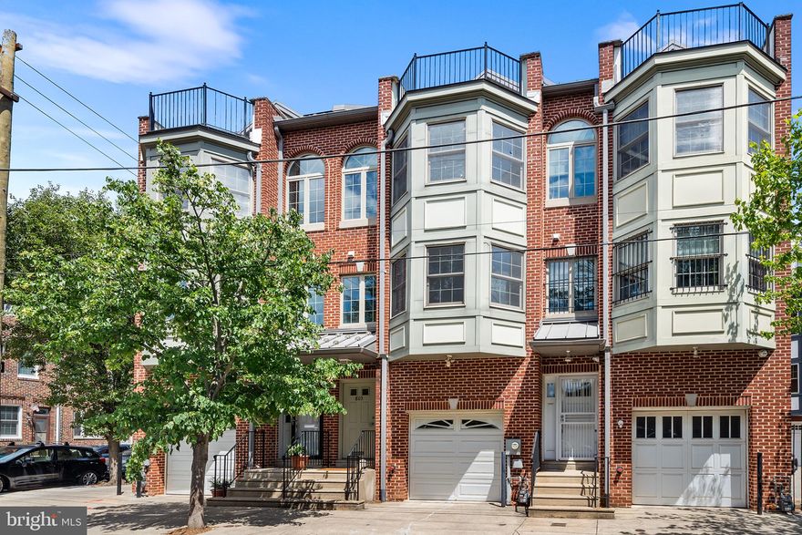 Looking for a move-in ready home with plenty of space to spread out, garage parking, private outdoor areas, and tons of storage, all in the sought after community of Bella Vista? Welcome to 803 S Darien Street, a contemporary 3-story home featuring 3 spacious bedrooms + flex space, 2 full baths, 1 powder room, basement for more space to lounge, and a spectacular outdoor deck with phenomenal city views! Enter the home through your private garage or the front door into a long hallway (think space for coats and bags) leading you to the flex space which could be a fourth bedroom, an office, a playroom, a workout room...whatever your needs are! This room features a powder room and access to the private back area. Down the stairs to the finished basement for more storage and more flex space. Ready to be wowed? Up to the main living area, this sun-drenched open floor plan is the heart of the home. Beautiful hardwood floors, a bay window, wide living/dining area- this is not your typical city home! New stainless steel appliances in the kitchen featuring plenty of cabinet and cooking/prep space.  Head upstairs to the two large bedrooms that share a tiled hall bath complete with a huge vanity and shower/tub combo. A full-size washer/dryer can also be found on this floor— no need to drag everything to the basement! Up to the top level where the stairwell is just as bright as the living area thanks to the skylight,  you’ll find the primary suite featuring two closets and an attached large bathroom with double vanity, and tub/shower.  Off the primary is the deck with amazing skyline views. What a place to wake up to in the morning and drink your coffee!  This home has been meticulously maintained.  Don’t miss the opportunity to live in this wonderful home in a lovely community with the friendliest neighbors.  Walking distance to delicious restaurants, coffee shops, the Italian Market, and a stone's throw from the best neighborhood parks and play grounds.  Easy access to public transportation, and to highways & major arteries for those commuting. You will experience the very best of city living in this gracious home.