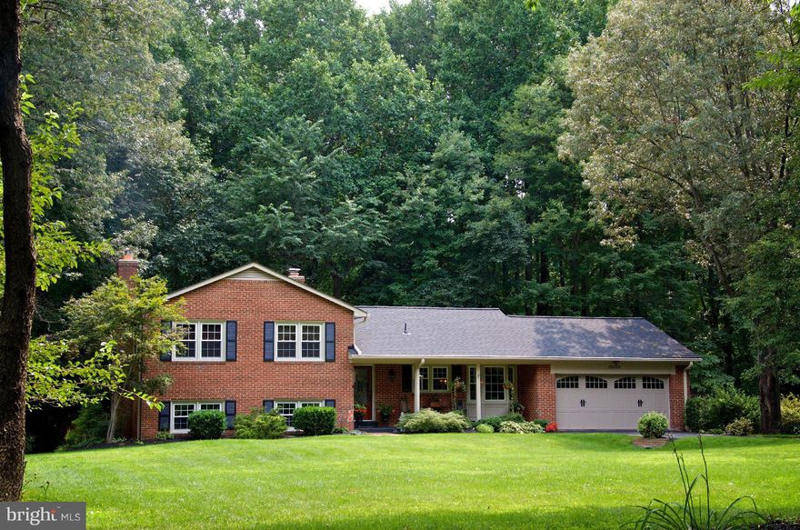 STUNNING, A MUST SEE! Every last thing updated. 4 sides brick SFH. Park like .49 acre lot backs to woods w/front porch, wood deck w/awning, patio & shed. 2 car garage. Open floor plan. Wood floors t-out main level. Remodeled Kitchen w/granite, recessed lights, breakfast bar. Updated FR w/surround sound. All baths redone! Large MBR suite. 4th lvl storage room. New roof, windows, paint, EVERYTHING!