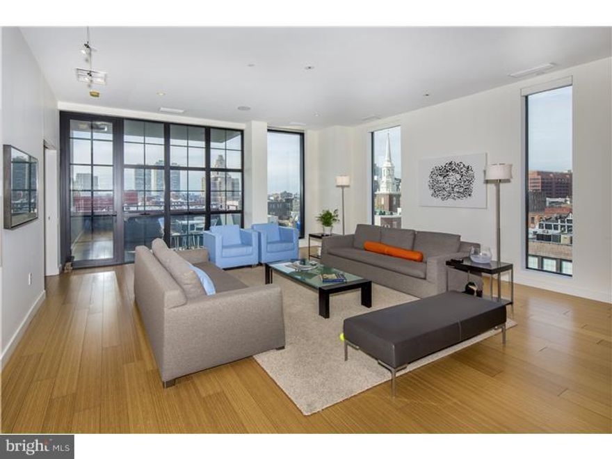 2,500 Square Feet Contemporary Loft Apartment Located in a Quiet 30 Unit Boutique Condominium Building. Enter the Apartment By Stepping Off One Of The Two Stainless Steel Elevators Directly Into the Dramatic Foyer and You'll Immediately Notice The Expansive Views, Bamboo Wood Floors and 10 ft. Ceilings. The Foyer Opens Directly Into the Huge Light-Filled Great Room with Its Kitchen, Dining Room and Living Room all Flowing into Each Other, Making it the Perfect Space For Entertaining Large Gatherings as Well as More Intimate Dinner Parties. Floor-To-Ceiling South and West Facing Windows Provide Unobstructed Views Of the Center City Skyline and the Delaware River. There Is A Natural Gas Line in a Living Room Wall Should the New Owner Wish to Install a Gas Fireplace. The Dining Room is Set Up For 10, But Easily Seats 20 Guests. The Chef's Kitchen Includes a 36" Viking Gas Range, Warming Drawer and Refrigerator, Two Fisher & Paykel Drawer-Style Dishwashers, Custom-Built Cabinets with Honed Granite Countertops, and Pantry Closet With a Microwave Oven. Immediately off the Great Room is a Large Den/Media, Which Provides Both a Place to Unwind and an Extension Of the Home's Entertainment Space with its Custom-Built Wet Bar, Viking Wine Refrigerator and Expansive River Views out the South-Facing Windows. The Master Suite Includes a Custom-Built Platform Bed, Which "Floats" in the Middle of the Carpeted Sleeping Area, Enormous Storage Capacity, and West and North Facing Floor-to-Ceiling Windows with Skyline and Bridge Views. The Master bath Includes Kohler & Grohe Fixtures, an Oversized Stone Shower with Massage Jets, a Custom Double-Sink Vanity with a Stone Countertop, a Separate Toilet Room and a Linen Closet. The Master Suite Includes Huge Custom Built Walk-In Closet with Ample Drawers, Hanging Space and Adjustable Shelving. The Second Bedroom has Views of the Ben Franklin Bridge, and Is Currently Used as an Office and Has a Built-In Desk and Its Own En-Suite Marble Bath with a Kohler Bathtub and Fixtures, and A Custom Vanity and Stone Countertop. Rounding Out The Home is a Marble Powder Room Off the Great Room, Which Includes a Custom Vanity, Stone Countertop, Phillipe Starke Vessel Sink & Faucet, a Private South-Facing Balcony, a Laundry Area with a Super Capacity Whirlpool Washer & Vented Dryer, a Large Storage Closet, Custom Blinds, Built-In Ceiling Speakers in the Great Room, Den and Master bedroom, & Covered Parking to Shield Your Vehicle From the Elements