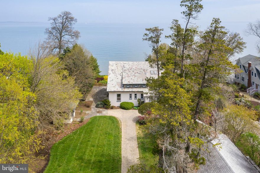 Original, classic Bay Ridge home built in 1922 offers panoramic, dramatic Northeast views of the Chesapeake Bay at the mouth of the Severn River. Perched high above River Drive on a double lot, this historic home is ready for the imaginative touch of its next owner. This the perfect home for family gatherings and relishing all that Bay Ridge has to offer.  Enjoy the Bay Ridge marina, playground, clubhouse, sandy beaches, and community pool. Watch spectacular sunrises, Wednesday night sailboat races, eagle and osprey nests - all from the front porch. Home includes beautiful quartersawn pine floors; original brass light fixtures; geothermal heating and cooling; mature landscaping w/outdoor lighting; double garage with second floor studio; loads of parking. This is a chance to purchase a seminal home in the history of Bay Ridge. Sold "As Is"