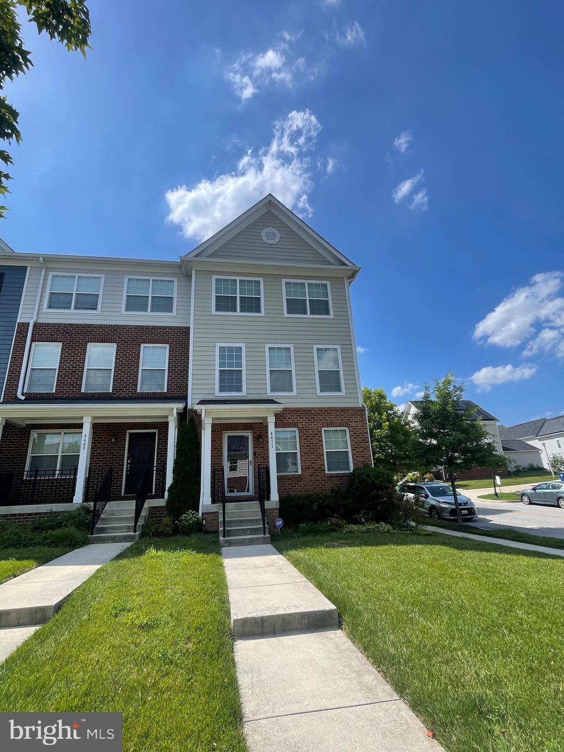 *Professional Photos go live on Thursday* Welcome to 4411 Maple Wood Drive where modern living meets community charm! Built in 2015, this spacious 4 bedroom, 2.5 bath end-unit townhome is located in the sought-after Uplands neighborhood of Southwest Baltimore. With over 1,600 square feet of finished living space across three levels, this home offers style, comfort, and convenience. Step inside to find a versatile entry-level bedroom or home office, a half bath, laundry area, and access to a one-car garage & 2 additional car driveway parking. The second level boasts an open concept layout with hardwood flooring, tall ceilings, and abundant natural light. Enjoy cooking in the contemporary kitchen featuring stainless steel appliances, granite countertops, and a large island perfect for entertaining. The adjoining dining area leads to a private rear deck, ideal for morning coffee or summer grilling. Upstairs, the primary suite includes a walk-in closet and en-suite bath, while two additional bedrooms share a full hallway bathroom. Thoughtful updates, neutral finishes, and ample storage make this home truly move-in ready. You'll enjoy easy access to major I-70, I-695 and nearby shopping centers.