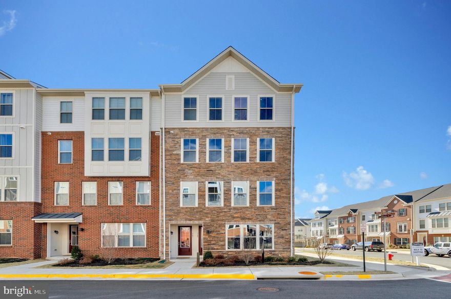Welcome home to Potomac Station! This gorgeous and brand new end-unit townhome-style condo is the picture of modern elegance, with an abundance of natural lighting and sleek contemporary finishes. On the main level, discover a spacious living room with wall-to-wall windows flooding the space with sunlight. Sleek luxury vinyl plank flooring flows seamlessly throughout the open floorplan into the dining room and kitchen, making the home ideal for entertaining. The stunning modern kitchen boasts abundant Shaker-style cabinets, quartz countertops, and stainless steel appliances, including an induction cooktop as well as a wall oven and microwave. Upstairs, the luxurious primary bedroom features plush carpeting and a massive walk-in closet. Inside the en suite bathroom you’ll find a wide double sink vanity with plenty of cabinet storage and a step-in shower with a built-in seat. Enjoy exclusive access to your private balcony to sip your morning coffee or watch the sun set. Both additional bedrooms include soft carpet and wide closets, with shared access to the second full bathroom in the hall. The conveniently located large laundry room rounds out this level of the home. Window blinds, washing machine, and dryer will be installed prior to move-in. On the back of the home, the 1-car garage and driveway provide you with extra storage space and easy parking. Minutes to the brand new Trader Joes, Giant, Wegmans, Costco, Walmart, Village at Leesburg, Leesburg Premium Outlets, CMX Cinemas, Red Rock Wilderness Overlook Regional Park, Morven Park, and Ida Lee Recreation Center. Quick access to Route 7, Route 15, and the Dulles Greenway. Schedule a private tour of your beautiful new home today!