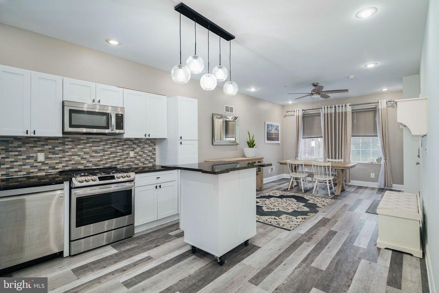 This home is available now for quick move-in. A stunning home for rent in Philadelphia with 3 bedrooms and 3.5 bathrooms, PLUS DEN (13' x 21'), and a huge outdoor space. This home is PET-friendly and located in Philadelphia's Graduate Hospital neighborhood. It features 2064 sq ft of living space. Nestled next to the charming Carpenter Green Park, this residence boasts a sun-drenched, large backyard (16.5' x 19'), complete with a large garden planter to cultivate your summer herb and vegetable garden plus plenty of space to entertain and cook outside. The first floor is an open-concept floor plan,  featuring a chef-style kitchen with ample countertop space, cabinetry for storage, and a versatile island. The (10" x 11") kitchen includes a full suite of appliances, a gas stove, a dishwasher, and a refrigerator.  The living area (11.4' x 16.4') next to the kitchen can be used as a multipurpose space, serving as a cozy living room and dining space, or a grand formal dining room. Down the hall toward the back of the house,  a conveniently placed half bathroom is perfect for guests. Next to it, there is a full bathroom with a sleek glass-walled walk-in shower exclusively there to serve the main level rear bedroom for an ensuite feel. This bedroom (13.2 x 12.5')  also makes a great home office. There are two sets of stairs. Upstairs, the second floor is dedicated to the luxurious primary bedroom suite (12.6' x 15.7') with an adjoining freshly renovated bathroom with a two-sided vanity, marble flooring, and exquisite shower tiles accented in black fixtures. The bedroom is large enough to accommodate a king-sized bedroom and large furnishings. It features a walk-in closet. The lower level introduces a DEN (13.6' x 21.5') for additional living space, perfect for a media room, along with a laundry closet equipped with a full-sized washer and dryer. A third cozy bedroom (12' x 12') at the back of the house is perfect for someone who enjoys sleeping in and privacy. Another full bathroom completes this level. Equipped with modern amenities like central heating, AC, and an optional security system, this home is a blend of modern finishes and large rooms in a convenient center city location. Located just two blocks from the Lincoln Square Shopping Center, you're steps away from Sprouts Farmers Market, Target, and various dining options. A short walk takes you to the vibrant Rittenhouse Square neighborhood and you have access to the Avenue of the Arts just 3 blocks away. Take advantage of this opportunity to live in a spacious home in Center City that is close to everything. Schedule a tour, move in, unpack, and enjoy.