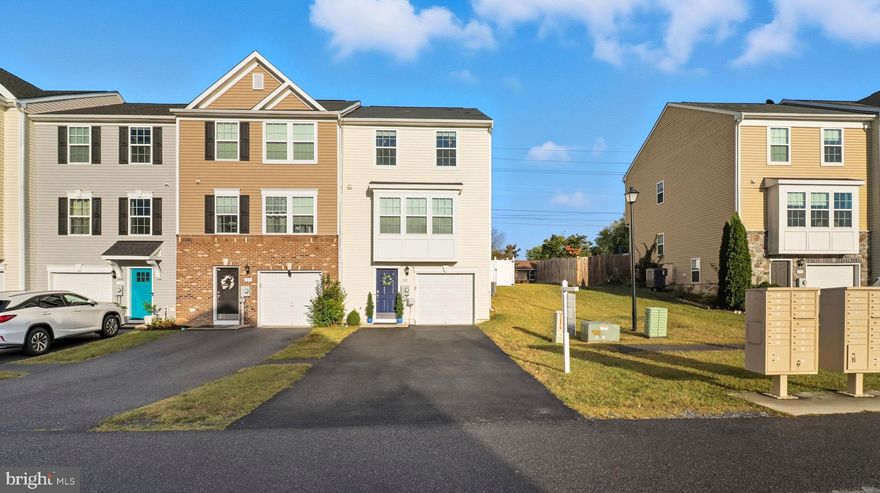 Welcome to 121 Natural Way, a meticulously maintained three-level end-unit townhome in the established Manor Park neighborhood of Martinsburg. Offering 3 bedrooms, 2 full baths, and 2 half baths, this spacious home also features smart-home technology, a one-car garage, a private driveway, and ample guest parking—providing comfort, convenience, and modern style throughout.

This is truly a turnkey property, with the majority of the furnishings conveying with the sale to make moving in seamless (please contact the co-listing agent for full details).

The main level features a bright living room and a separate dining area with plenty of room to gather and entertain, while the kitchen provides abundant cabinet storage and generous counter space, ready for your personal touches. Upstairs, the primary suite includes a full bath, with two additional bedrooms and a second full bath completing the upper level. The finished daylight lower level adds valuable bonus space for a home office, media room, playroom, or gym.

Step outside to enjoy a brand-new fenced yard that offers privacy, security, and the perfect space for pets, gardening, or weekend barbecues. Sidewalks throughout Manor Park make it easy to enjoy evening walks, while open green spaces offer room to relax and play.

This location also provides convenient access to shopping, dining, and schools, along with quick routes to I-81, Route 9, and the MARC Train station for commuting to Northern Virginia, Hagerstown, or Washington, D.C. Dulles International Airport and BWI are both within easy reach for longer trips.