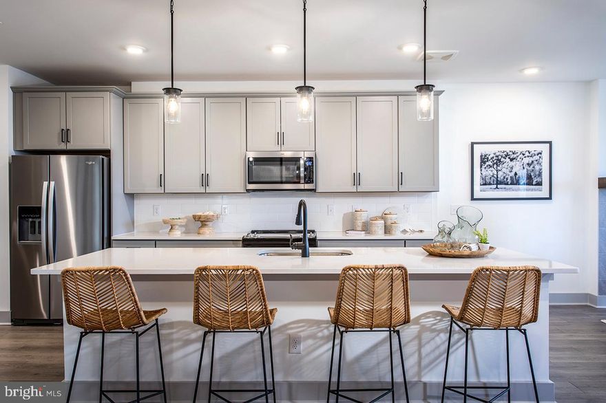Ready for Fall move in!! Step into the Sherwyn, a beautifully crafted single-story condo home nestled in Gatherings at Cabin Branch, Clarksburg’s premier 55+ community by Beazer Homes. This thoughtfully designed new construction offers 3 spacious bedrooms and 2 full baths, perfectly blending elegance, comfort, and convenience. With 1,887 sq. ft. of open-concept living, you’ll be greeted by a bright and welcoming living room, a modern kitchen featuring an oversized island, abundant cabinetry, and a walk-in pantry—ideal for both everyday living and entertaining. The adjacent dining area sets the stage for cozy dinners and lively gatherings. Your primary suite is a serene retreat, complete with a spa-inspired en-suite bathroom featuring a dual vanity, soaking tub, walk-in shower, and a generous walk-in closet. Two additional bedrooms offer flexibility for guests, hobbies, or a home office. Enjoy fresh air and peaceful mornings on your private balcony and take advantage of the walk-in laundry room for added convenience. Located in a controlled-access building, residents enjoy exclusive amenities like a billiards room, movie theatre, golf simulator, and more. Additional highlights include a 1-car garage and valet trash service three times a week. Plus, enjoy access to the clubhouse, fitness room, community gardens, and amore, plus nearby Clarksburg Premium Outlets for shopping and dining. Don’t miss your chance to live the lifestyle you deserve. Special buyer incentives may include closing cost assistance—schedule your appointment today and make the Sherwyn your new beginning.