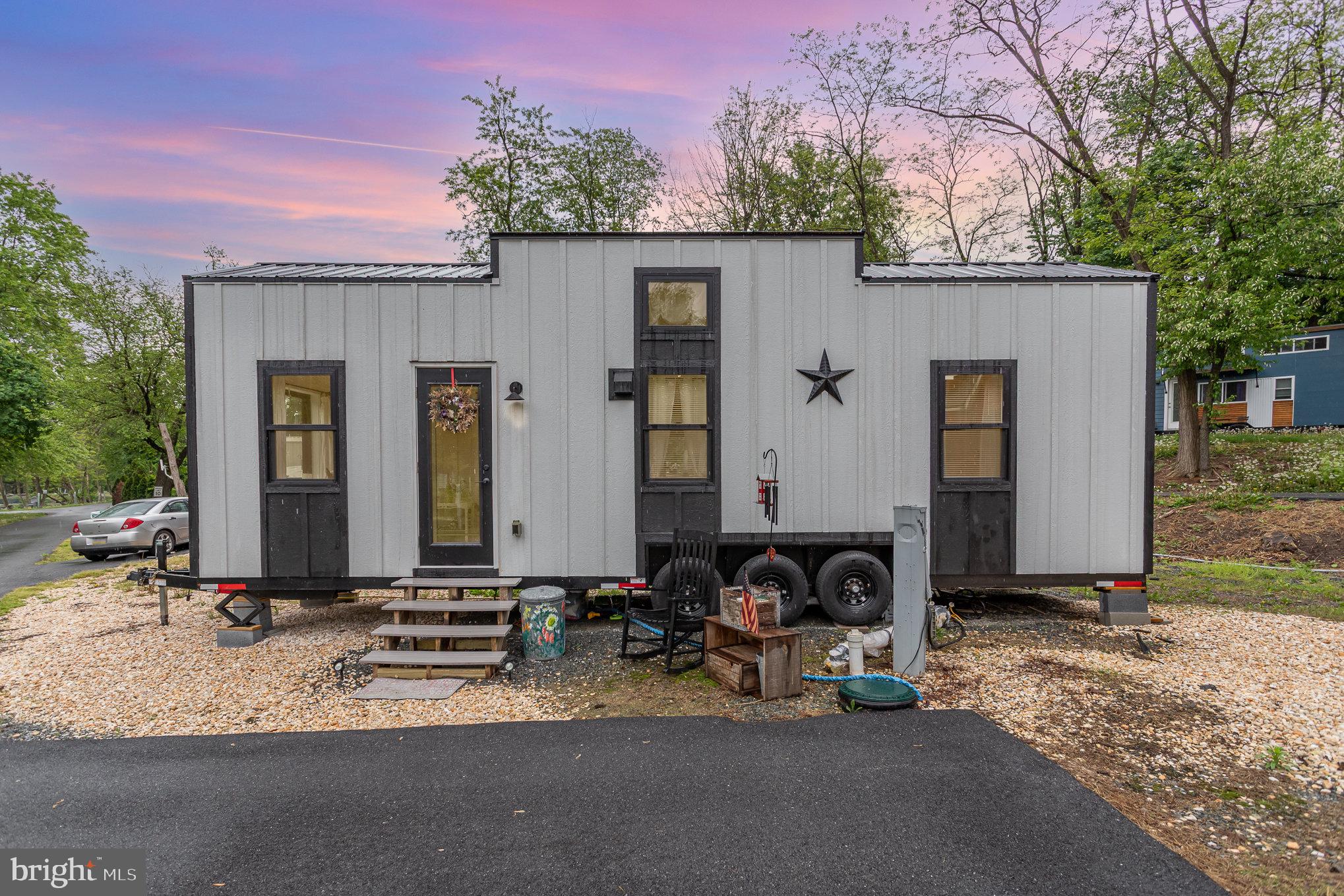 Step into tiny home living with this handcrafted 300 sq ft retreat. This beautifully designed tiny home offers a smart layout that maximizes space and comfort without compromising on style . This home resides at Tiny House Estates, a quiet, gated tiny house community in Elizabethtown PA. If purchased it can be moved or kept on the lot. Featuring 1 bed, 1 bath, and a loft for a secondary bedroom, this home is perfect for simple, easy living. Tiny Home is ANSI 119.5 and NOAH certified. If kept on the lot, lot rent is $750 per month (includes water, sewer, electric, propane, internet and trash). Schedule a showing today!