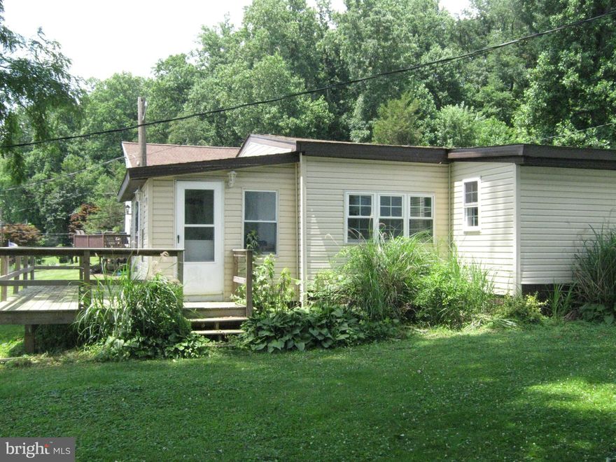 Cool Family Getaway Home with Wonderful Views overlooking the Susquehanna River. Quiet community within walking distance to the Marina and Ample Parking for Cookouts with Family and Friends just to hang out.  Home has been updated: Removed and Replaced roof 2015, Replaced siding/wrapped house, Replaced most Windows 2015, Added Front Picture Window (all modern 2 Pane Windows now), Added/Rebuilt Deck . Added Skirting around House, Painted inside of House, Converted dining room to bedroom, Replaced hot water Heater 2015, Replaced toilet,  Replaced all flooring, Replaced Propane Heater, Repaired and Painted Shed 12 x 24 ,  Added exterior lights, Pumped Septic, Really must see!!