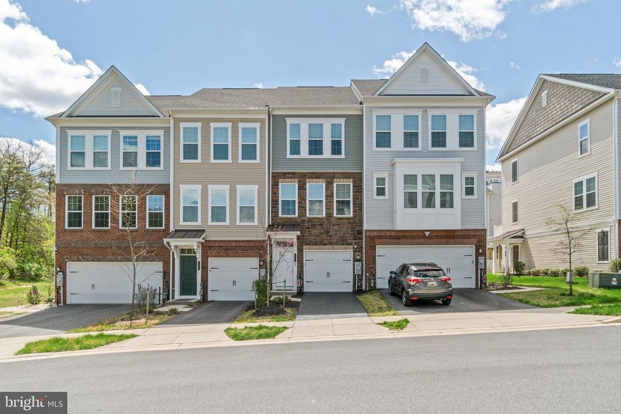 **We have multiple offers in hand and the seller has asked for best and final offers with no escalation clauses by 9pm this evening, April 28.** Rarely available and impeccably maintained, this stunning 4-level townhome offers luxury, space, and convenience in one pristine package. Featuring 3 spacious bedrooms—each with its own en suite bath—this home is designed for both comfort and privacy. The top-level loft with private balcony provides a perfect retreat or flex space for a home office or guest suite. A bright white kitchen dazzles with granite countertops, stainless steel appliances, and opens directly to a low-maintenance composite deck—ideal for entertaining or relaxing.
Builder upgrades are evident throughout, from gleaming hardwood floors that flow across most levels to the sophisticated finishes that make this home show like a model. The oversized 1-car attached garage adds practical storage, while the stone and vinyl siding exterior adds timeless curb appeal. Enjoy the ease of upper-level laundry, abundant natural light, and a location that's just minutes from shopping, dining, and major commuter routes including 295, 95 with access to Washington DC, and Baltimore. Like-new and move-in ready—this is the one you've been waiting for!