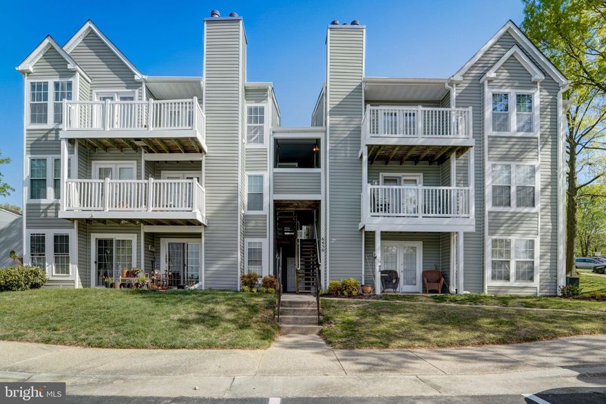 Welcome to this well maintained, sun-filtered condo in the desired Rockburn Commons area of Elkridge! Boasting two large bedrooms with spacious closets, and one bath, this home offers both functionality and elegance. Step into the spacious living room, where the doors open to a walk out patio overlooking open green space, providing a seamless indoor-outdoor living experience. The updated kitchen features updated appliances, complemented by gleaming hardwood floors that flow throughout the home, and with carpeting in the bedrooms.  With the convenience of a full-sized washer and dryer, every aspect of modern living has been considered. Experience the comfort of this home located within walking distance to the library, plenty of shopping options, easy access to major roads, all in the convenience of Elkridge. Move in ready!