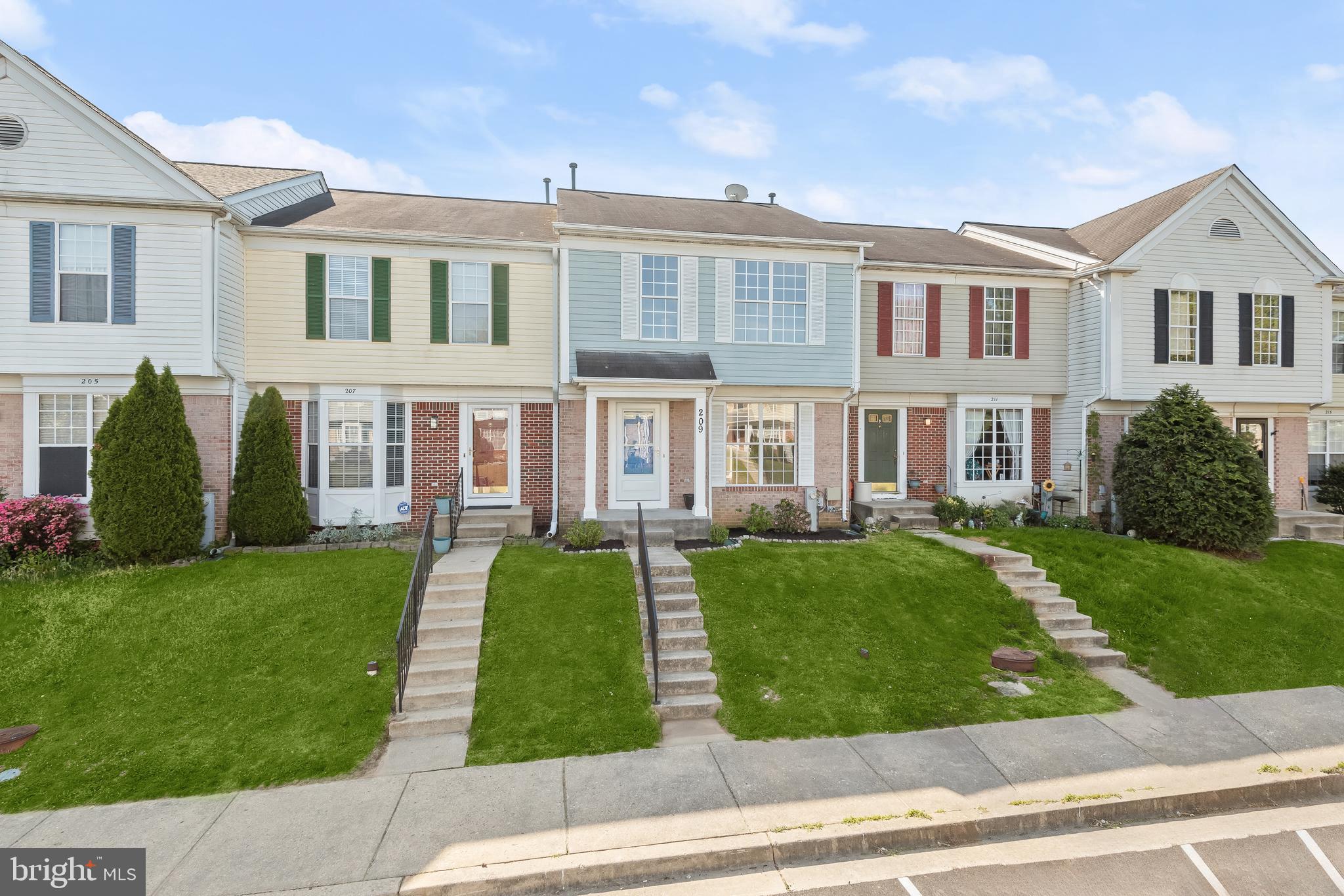Welcome to this sun-filled three bedroom, two full and one half bathroom townhome in the desirable Seven Oaks community. The inside highlights a freshly-painted modern neutral color theme, new lighting, new luxury vinyl plank flooring and carpet, and updated bathrooms. The front living room welcomes you, and the dining room features sliding glass doors to the rear deck. The newly-updated kitchen boasts new quartz countertops, appliances, backsplash, and cabinets, along with a convenient pantry. A half bathroom completes the main level. Upstairs, the primary bedroom has a soaring vaulted ceiling, a walk-in closet, and an en-suite bathroom. Another two bedrooms and a second full bathroom complete the upper level. The finished lower level includes an expansive recreation room with access to the rear yard, and a new window. The utility room provides additional storage. Enjoy spending time outside on the deck or in the rear yard. Plenty of parking and fantastic community amenities. Excellent location close to 32, Fort Meade, and other commuter routes. Some images have been virtually staged.
