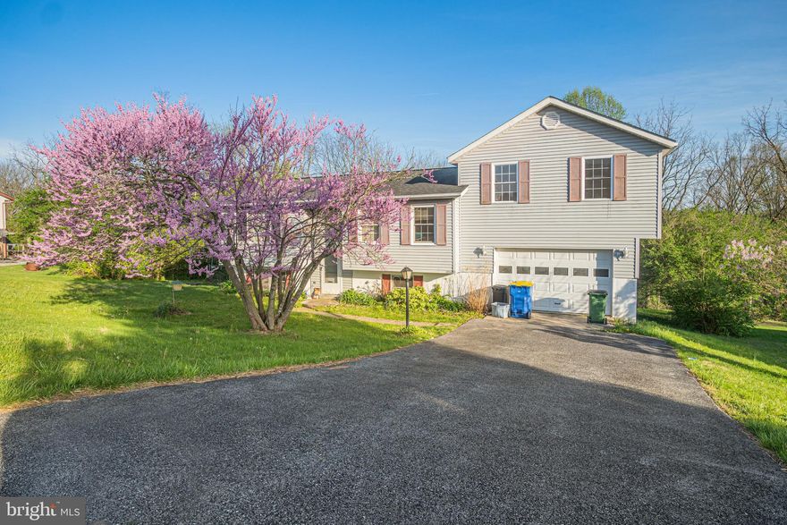 Nestled in the picturesque landscape of South Hanover, welcome to 253 Vegas Dr, a home awaiting someone's love and care. Boasting an array of amenities and a prime location, this home presents an unparalleled opportunity. Spanning 1,884 square feet, this home features 3 bedrooms and 2 full baths. Step inside and be greeted by hardwood flooring on the main level. The kitchen, complete with granite countertops, a dishwasher, peninsula, and abundant cabinetry, offering both functionality and elegance for culinary enthusiasts. An impressive large addition above the garage adds versatility to the living space, providing the perfect spot for an additional bedroom, gym, or additional entertainment area, limited only by your imagination. In the basement you'll discover a primary bedroom retreat with its own bath, offering additional privacy.  Conveniently located just minutes from the MD/PA line. Residents will also enjoy easy access to nearby attractions such as Codorus State Park, offering endless outdoor recreational activities for nature enthusiasts. With Walmart a mere 1.5 miles away and local grocery stores and restaurants within a 2-mile radius, everyday essentials and dining options are always within reach. Don't miss the opportunity to make 253 Vegas Dr your new home sweet home. Schedule your showing today!