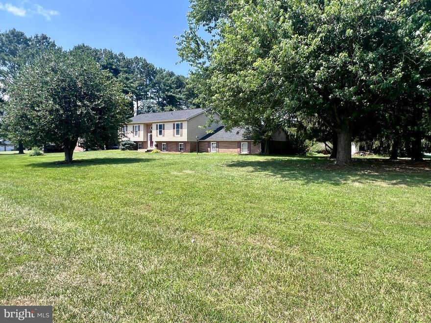 This is a unique one! Beautiful 1+ Acre Corner Lot! Car enthusiast? Perfect for the Garage Hobbyist! 2 oversized 2 Car Garages - attached/rear access garages AND a detached garage too! New roof in 2024! This home has a unique floor plan & a great use of space.   This home is eligible for a VA Assumption for a VA Buyer who wants to take advantage of a low interest rate.  Schedule today!