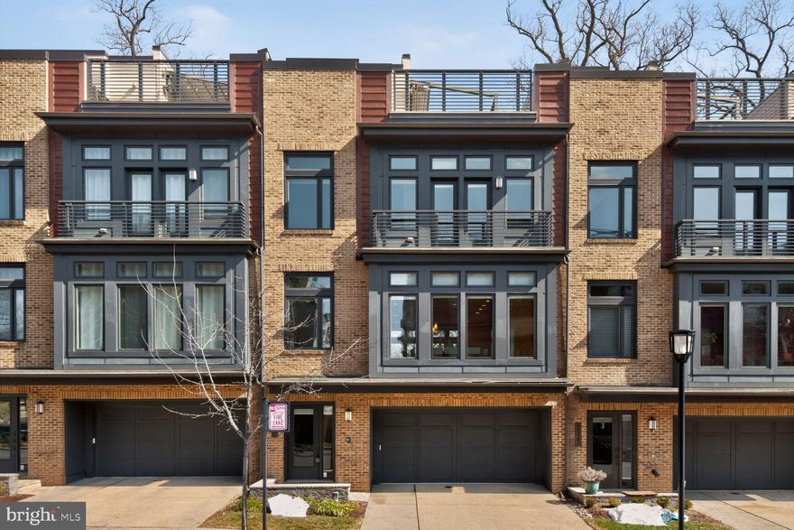 Open Sat 11-1 and Sun 1-3

Welcome to Grosvenor Heights — where elevated living is more than just a metaphor.
This is The Harrison, an EYA townhome that hits different. With over 3,500 square feet tucked into a lush, park-like setting, this is the kind of place where you actually want to be home. Backing to a canopy of trees in spring and summer, the views are the vibe — and the light? Unreal, thanks to dramatic floor-to-ceiling windows flooding every level.
Skip the stairs (literally) — your private elevator connects all four floors, from the entry-level flex space — perfect as a home office, hangout room, or whatever suits your life — all the way up to the crown jewel: a rooftop terrace that's straight-up made for a good time. We're talking a Viking Professional outdoor kitchen, gas BBQ grill, and a retractable awning for those golden-hour hangs.
Back inside, soaring 10-ft ceilings on the main level set the tone for a space that feels as good as it looks. The sleek, modern kitchen is chef-approved, featuring designer cabinetry, granite countertops, a seamlessly integrated fridge and dishwasher, and Thermador stainless steel appliances. Pull up to the island for a casual weeknight dinner or enjoy the dining area for the dinner party you've been meaning to host. The great room anchors it all with a modern gas fireplace — cozy, cool, and completely on-brand.
When it's time to recharge, the primary suite delivers: a generous walk-in closet, a frameless glass shower, and a dual-sink vanity that makes getting ready feel like a ritual worth savoring.
And the location? It seals the deal. Minutes from the Grosvenor-Strathmore Metro with top-tier shopping, dining, and entertainment right at your fingertips — nature and city, perfectly balanced.
This isn't just a home. It's a whole lifestyle.