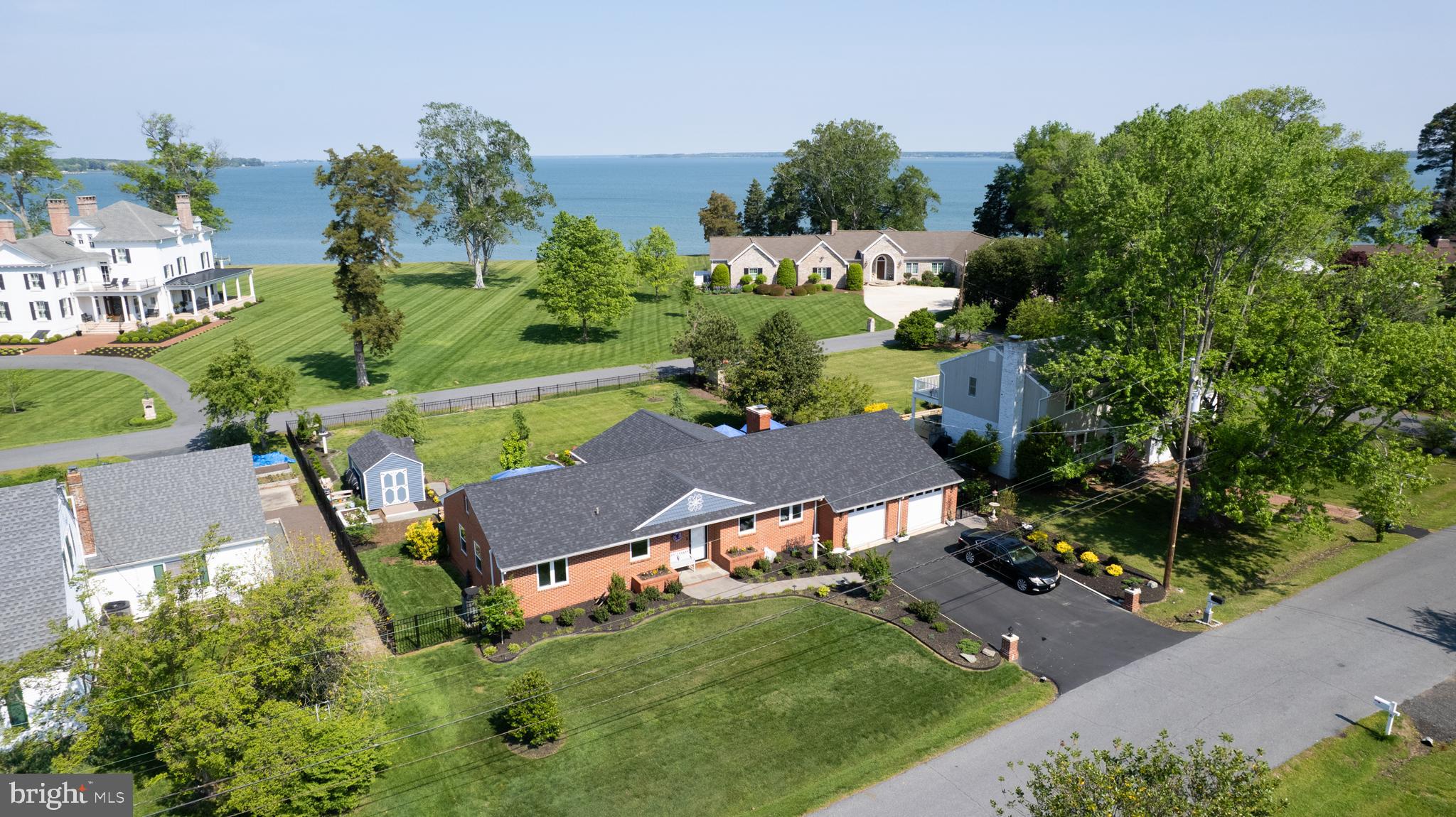 Welcome to this custom brick rancher with a stunning view of the broad waters of the Choptank River from the primary bedroom and bath and living room. Recently the home has been completely remodeled including but not limited to- new windows /window shades, re-shingling of roof, new flooring, new cabinetry, pocket doors, double blacktop driveway, fenced rear yard, painting throughout, and new appliances. The three (3) bedroom - two (2) bath residence offers open concept living consisting of kitchen, sunroom, and living room with wood burning fireplace. The attached large composite deck is accessed from the primary bedroom as well as the sunroom. Both baths have new tile, vanities and Bluetooth speakers. The attached two (2) car garage is currently being utilized as a game room and an office area. This is still a functional for a two (2) car garage! The rear fenced yard has a landscaped. FIREPIT AREA and a large shed. The property is currently an AIRBNB with a FIVE STAR RATING. Public water and sewer serve the property without CITY PROPERTY TAXES. A community boat dock is a short walk down the street. Cambridge provides downtown shops, restaurants, parks and a public marina.
Furniture is available for Inclusion at an additional price to be negotiated.
