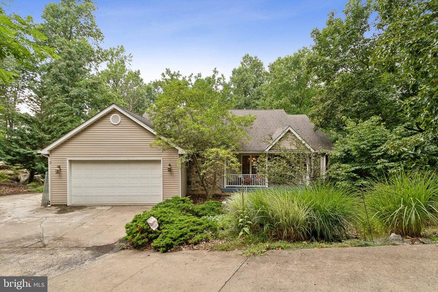 Welcome to 338 Shenandoah Valley Drive in the Gated Community of High Knob.  The front porch is so inviting and has room for rocking chairs to enjoy nature.  Open up the front door and as soon as you enter this home you will be in a foyer and to your right is the formal dining room with lots of light and a tray ceiling.  Beautiful hardwood flooring on most of the main level.  To your left is a large kitchen with a breakfast nook.   There are tons of countertop space and storage space in this kitchen with upgraded counters.  A hybrid range with a propane cooktop and electric oven for baking.  Around the corner is your amazing living room with a propane fireplace with beautiful stonework.  Large windows at the end that overlook the backyard and also have views of Skyline Drive in the fall.  Exit the door to the HUGE wrap-around deck.  Look at the room!  Next up is the big primary bedroom with a skylight and a large closet.  Primary bath as a soaking tub and stall shower with double vanity.  Down the hall is two additional bedrooms with a full bath. Next, we make our way to the one-of-a-kind basement!  OH MY GOSH LOOK AT THIS!  HUGE BASEMENT!  The two-level basement where one side is unfinished for all your storage needs and a rough-in for a bathroom.  The other side has 14' ceiling and lots of space!  BLOWN AWAY! Look at the space and the unlimited possibilities.  French door to exit the home to your fully fenced-in-yard backing to trees.  The HVAC system is a hybrid heat pump that switches to a gas furnace when the temps get frigid. You must see this home to appreciate all it has to offer!  All this in a prestigious gated community with great amenities including a clubhouse, pool, tennis, and picnic area. A spectacular scenic haven surrounded by the Blue Ridge and Shenandoah mountain ranges with so much to enjoy and explore, hiking, nearby Luray and Skyline caverns, rivers, wineries, and plenty of diverse dining yet easy access to I66, John Marshall Hwy, and Winchester with all its amenities!  Remember to enter the community from High Knob Road, not Massanutten Mountain Rd or you can if you're ready for some off-road fun!