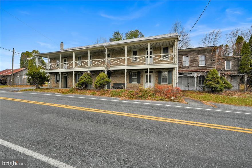 Rich in history this Circa dating to 1770 providing 11,000 sq ft of possibilities and registered on the Berks County Historical Society provides endless opportunity. Previously utilized as a restaurant and inn with past uses likely including a post office and store. The current structure includes a generous kitchen with commercial restaurant equipment in place, walk in coolers, multiple dining rooms and large bar room plus guest rooms and bath upstairs. The charm is ever present with stone fireplace, wide plank pine floors, surprisingly large open rooms, a full length outside covered porch on 1st and 2nd floor. Let your imagination open up in the all stone structure with high ceilings, multiple stairways and access points creating a versatile structure for your plan for it's future. The property is generous size of 5.5 acres and includes a large pole building a history of electricity and various points of water access on the property. There are outside gazebos as well. Farm to table, bed and breakfast, event facility, catering are all uses that come to mind. Clearly this important building played a role in early travel, community life and social scenes. Just think of what it can be today and the role it will play in the future. Check into this living piece of local history today.